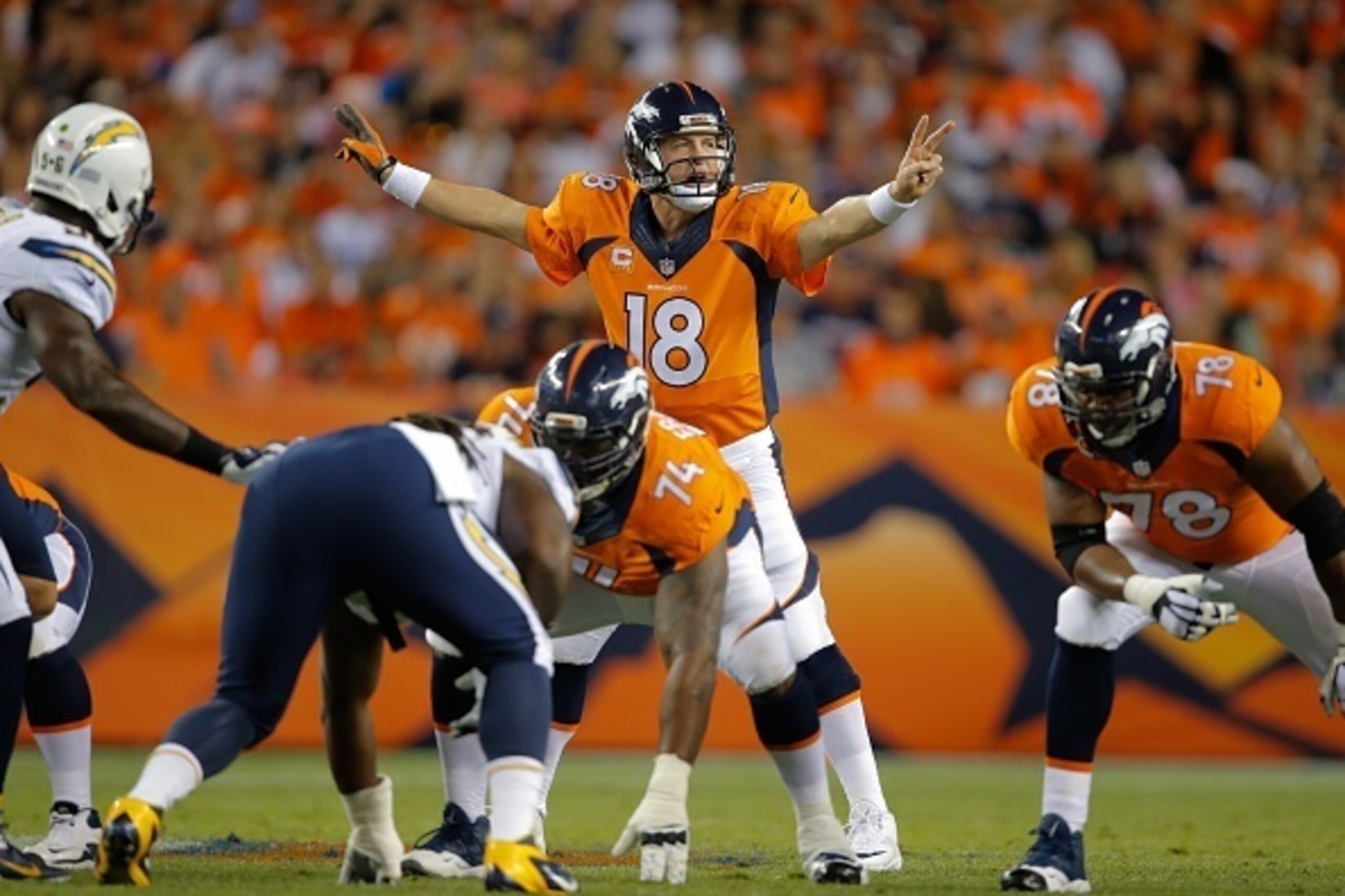 DENVER, CO - OCTOBER 23:  Quarterback Peyton Manning #18 of the Denver Broncos runs the offense against the San Diego Chargers during a game at Sports Authority Field at Mile High on October 23, 2014 in Denver, Colorado.  (Photo by Doug Pensinger/Getty Im