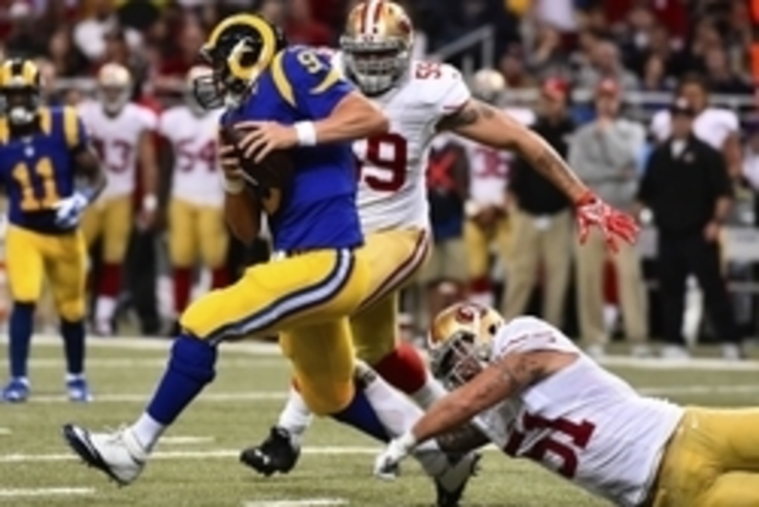 Oct 13, 2014; St. Louis, MO, USA; San Francisco 49ers outside linebacker Dan Skuta (51) attempts to tackle St. Louis Rams quarterback Austin Davis (9) during the first half at the Edward Jones Dome. Mandatory Credit: Jasen Vinlove-USA TODAY Sports