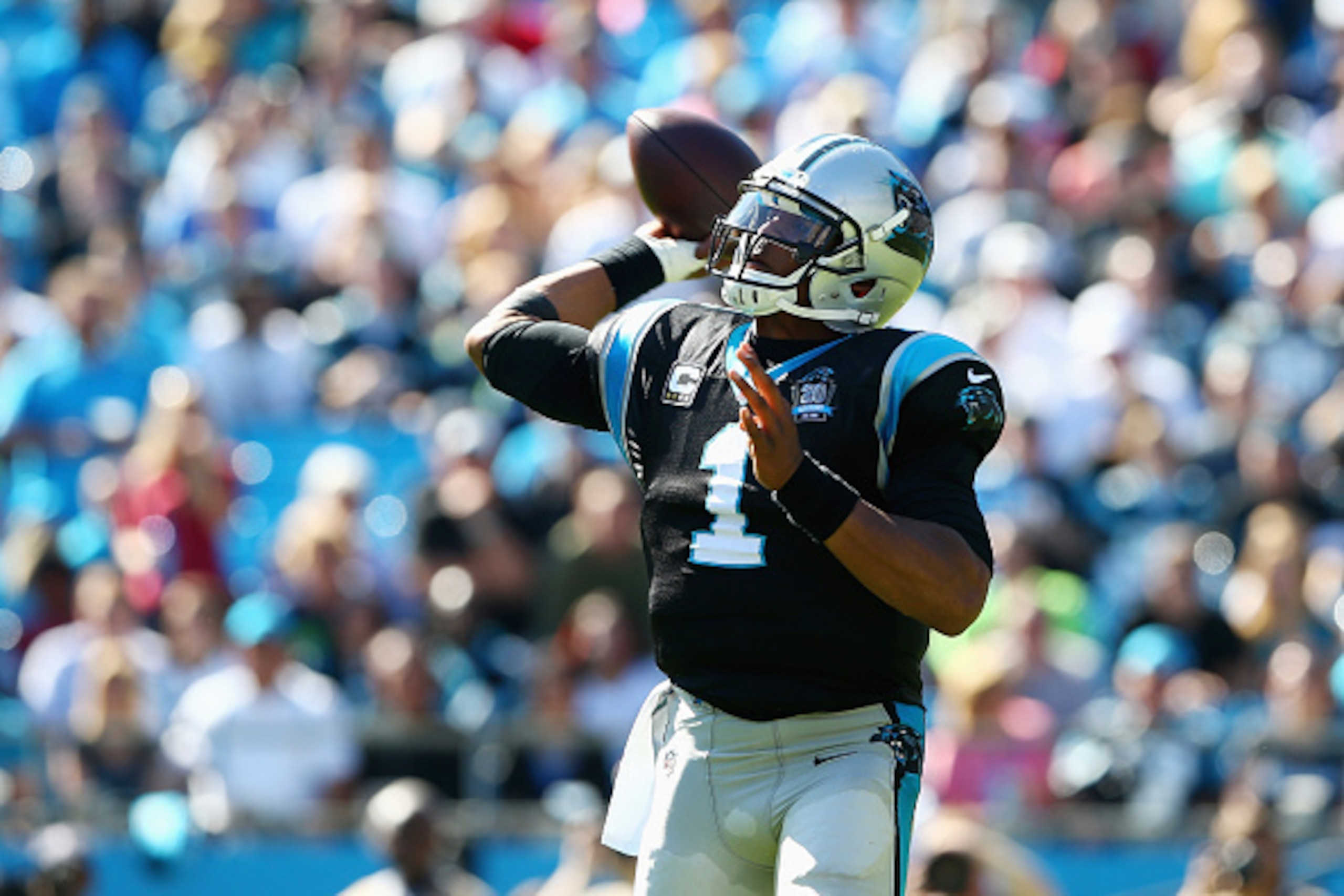 CHARLOTTE, NC - OCTOBER 26:   Cam Newton #1 of the Carolina Panthers throws a pass against the Seattle Seahawks in the 1st half during the game at Bank of America Stadium on October 26, 2014 in Charlotte, North Carolina.  (Photo by Streeter Lecka/Getty Im