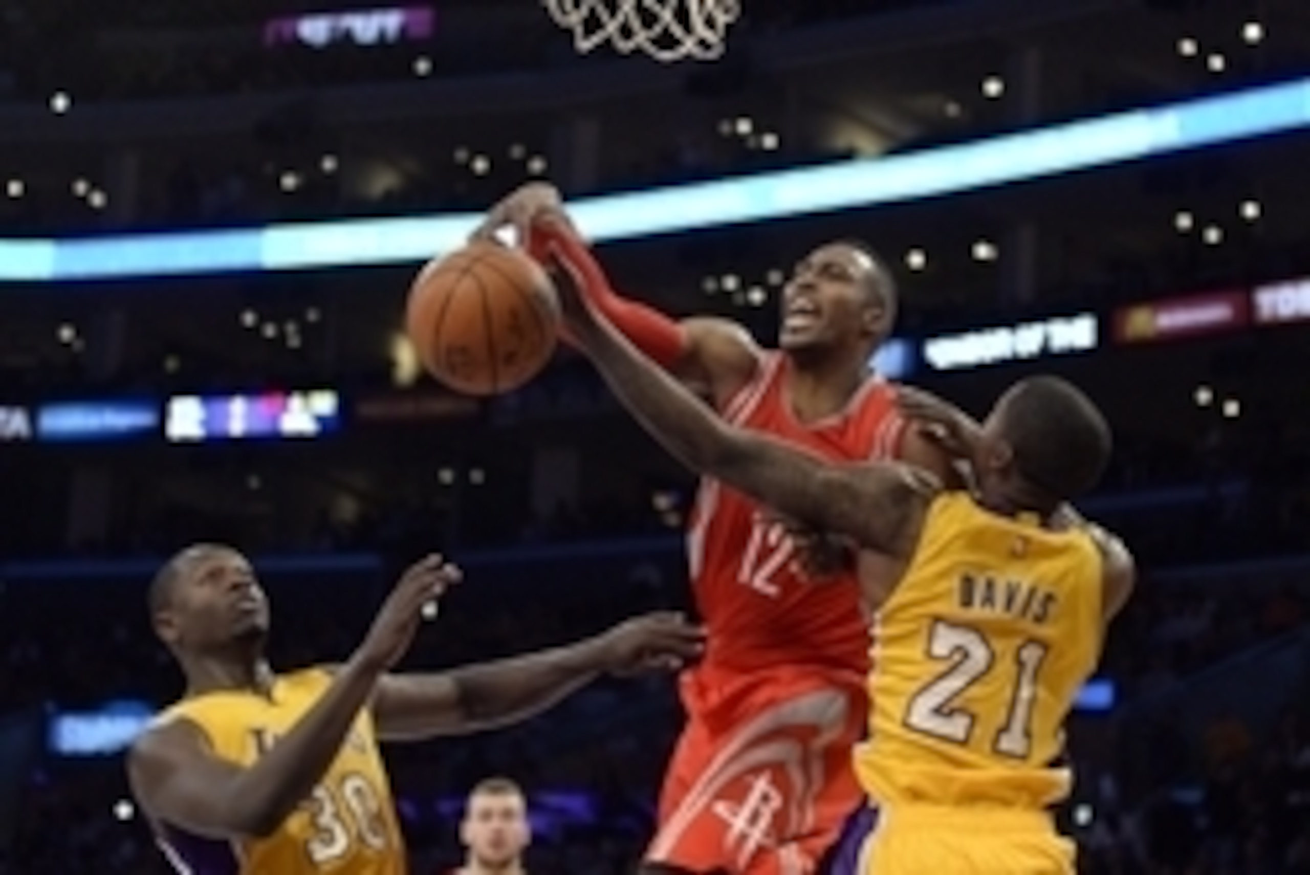 Oct 28, 2014; Los Angeles, CA, USA; Los Angeles Lakers forward Ed Davis (21) defends against Houston Rockets center Dwight Howard (12) during the first half at Staples Center. Mandatory Credit: Richard Mackson-USA TODAY Sports