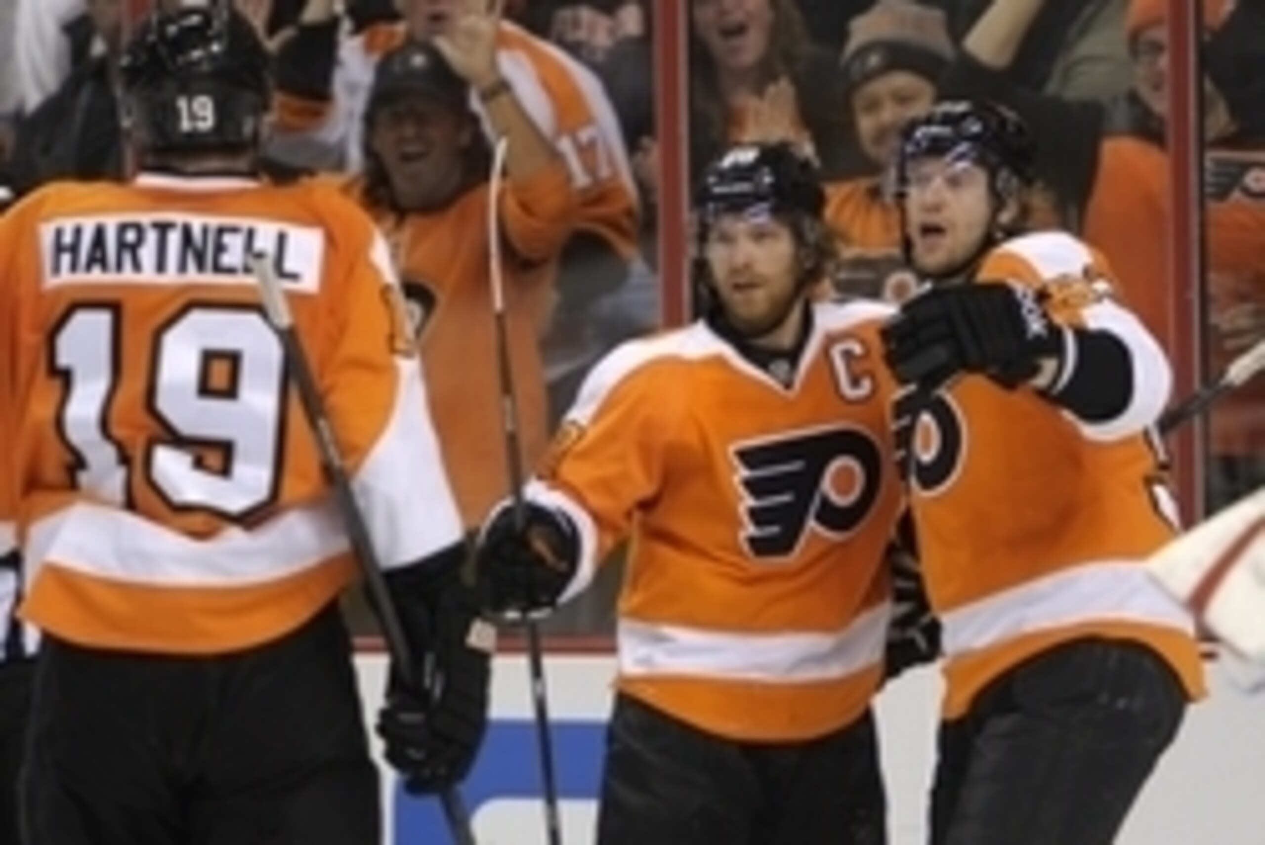 Mar 5, 2014; Philadelphia, PA, USA; Philadelphia Flyers center Claude Giroux (28) celebrates his goal with right wing Jakub Voracek (93) and left wing Scott Hartnell (19) against the Washington Capitals during the second period at Wells Fargo Center. Mand