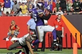 Oct 26, 2014; Tampa, FL, USA; Minnesota Vikings outside linebacker Anthony Barr (55) breaks the tackle of Tampa Bay Buccaneers wide receiver Mike Evans (13) for a 27-yard fumble recovery for a touchdown to win the game as the Vikings beat the Tampa Bay Bu