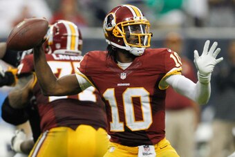 HOUSTON, TX - SEPTEMBER 07:  Robert Griffin III #10 of the Washington Redskins throws down-field in the fourth quarter against the Houston Texans at Reliant Stadium on September 7, 2014 in Houston, Texas.  (Photo by Bob Levey/Getty Images)
