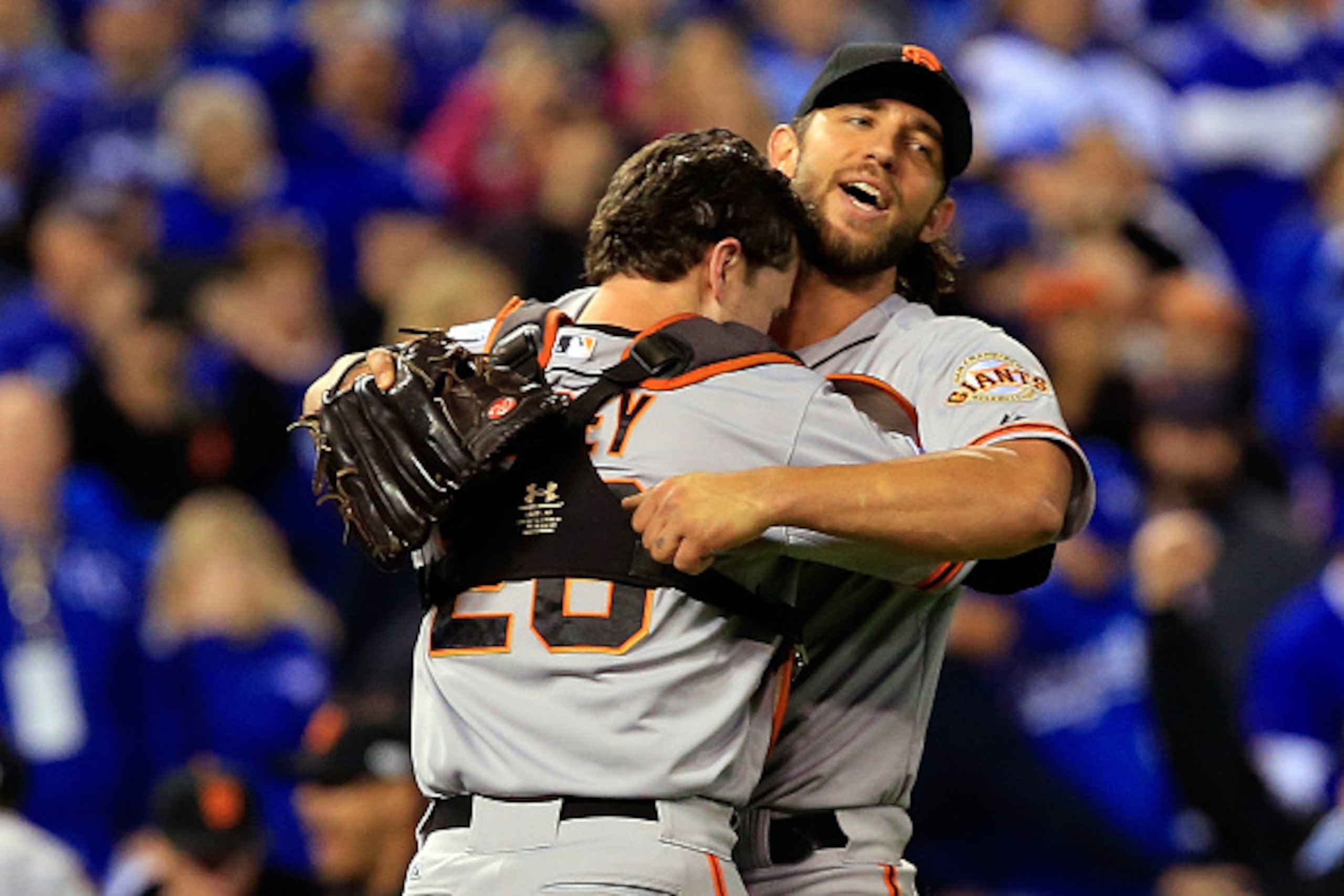 KANSAS CITY, MO - OCTOBER 29:  Buster Posey #28 and Madison Bumgarner #40 of the San Francisco Giants celebrate after defeating the Kansas City Royals to win Game Seven of the 2014 World Series by a score of 3-2 at Kauffman Stadium on October 29, 2014 in 