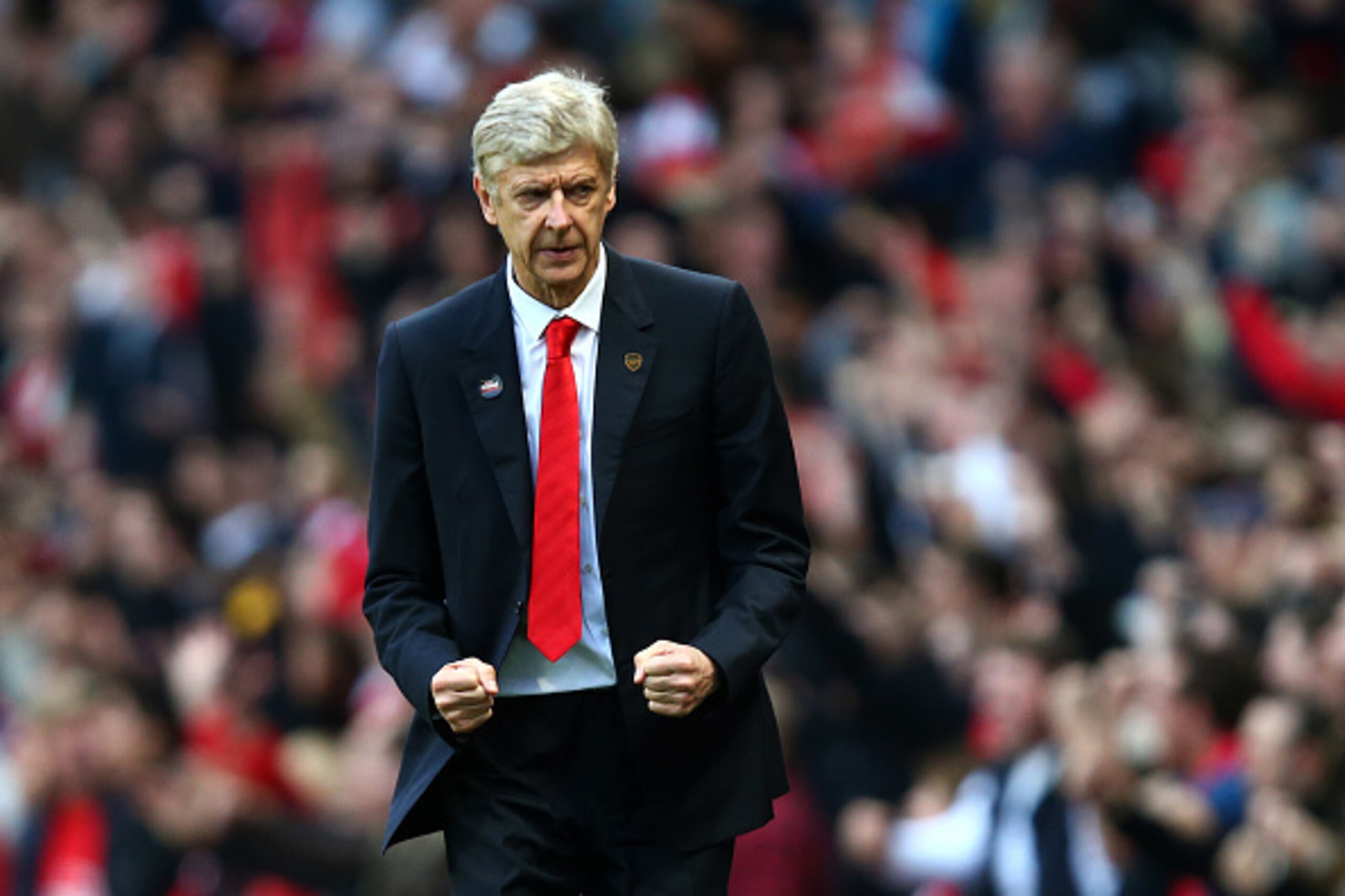 LONDON, ENGLAND - OCTOBER 18: Arsene Wenger, manager of Arsenal celebrates after Danny Welbeck scored his team's second goal during the Barclays Premier League match between Arsenal and Hull City at Emirates Stadium on October 18, 2014 in London, England LONDON, ENGLAND - OCTOBER 18: Arsene Wenger, manager of Arsenal celebrates after Danny Welbeck scored his team's second goal during the Barclays Premier League match between Arsenal and Hull City at Emirates Stadium on October 18, 2014 in London, England