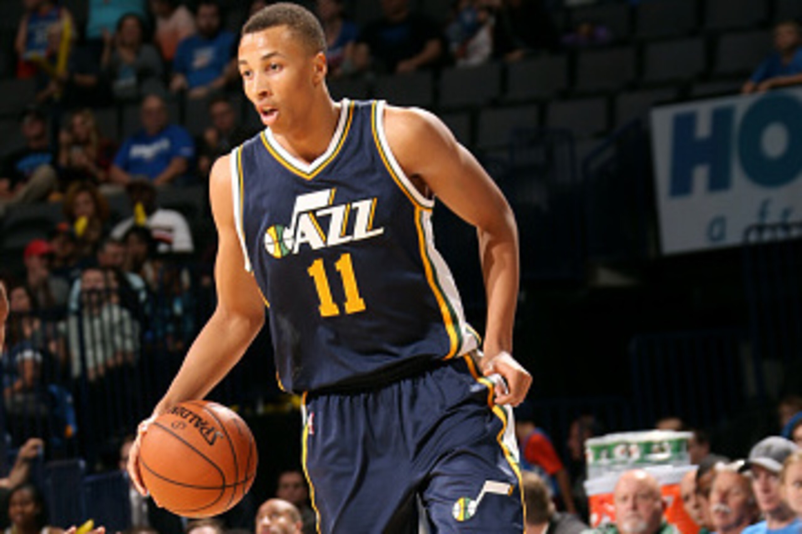OKLAHOMA CITY, OK - OCTOBER 21: Dante Exum #11 of the Utah Jazz handles the ball against the Oklahoma City Thunder on October 21, 2014 at Chesapeake Energy Arena in Oklahoma City, OK. NOTE TO USER: User expressly acknowledges and agrees that, by downloadi