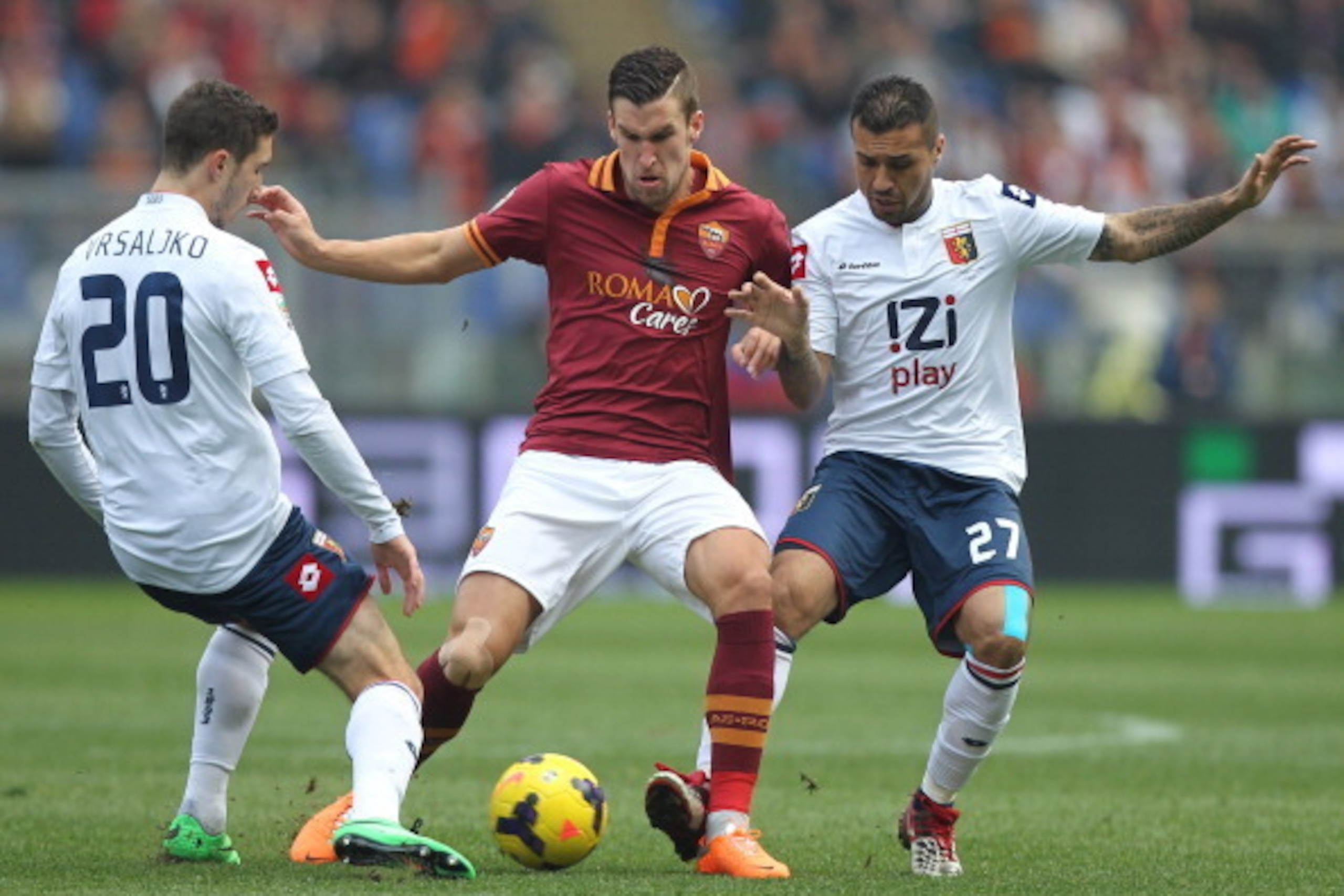 ROME, ITALY - JANUARY 12:  Kevin Strootman (C) of AS Roma competes for the ball with Sime Vrsaljko (L) and Francelino Matuzalem of Genoa CFC during the Serie A match between AS Roma and Genoa CFC at Stadio Olimpico on January 12, 2014 in Rome, Italy.  (Ph