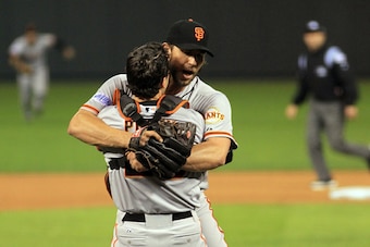 KANSAS CITY, MO - OCTOBER 29:  Buster Posey #28 and Madison Bumgarner #40 of the San Francisco Giants celebrate after defeating the Kansas City Royals to win Game Seven of the 2014 World Series by a score of 3-2 at Kauffman Stadium on October 29, 2014 in 