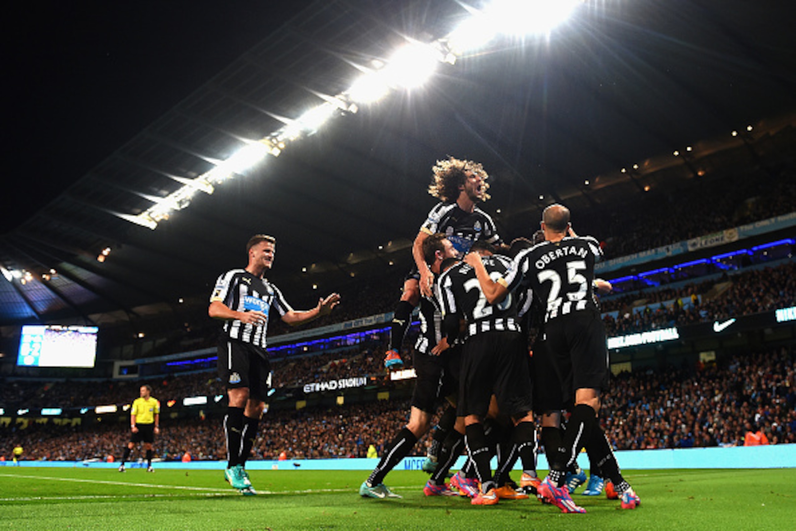 MANCHESTER, ENGLAND - OCTOBER 29:  Moussa Sissoko of Newcastle United  is mobbed by team mates after  scoring their second goal during the Capital One Cup Fourth Round match between Manchester City and Newcastle United at Etihad Stadium on October 29, 201