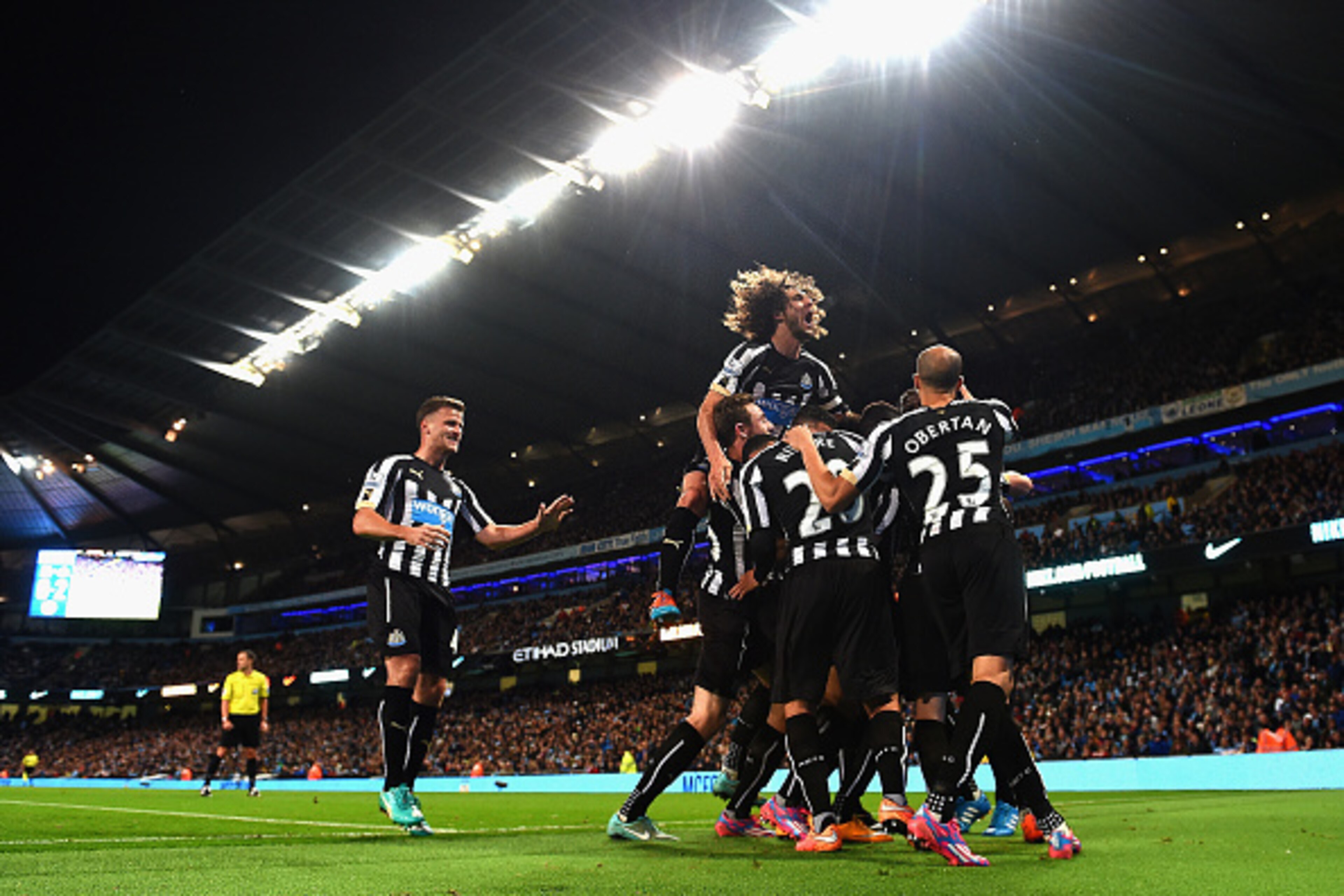 MANCHESTER, ENGLAND - OCTOBER 29:  Moussa Sissoko of Newcastle United  is mobbed by team mates after  scoring their second goal during the Capital One Cup Fourth Round match between Manchester City and Newcastle United at Etihad Stadium on October 29, 201