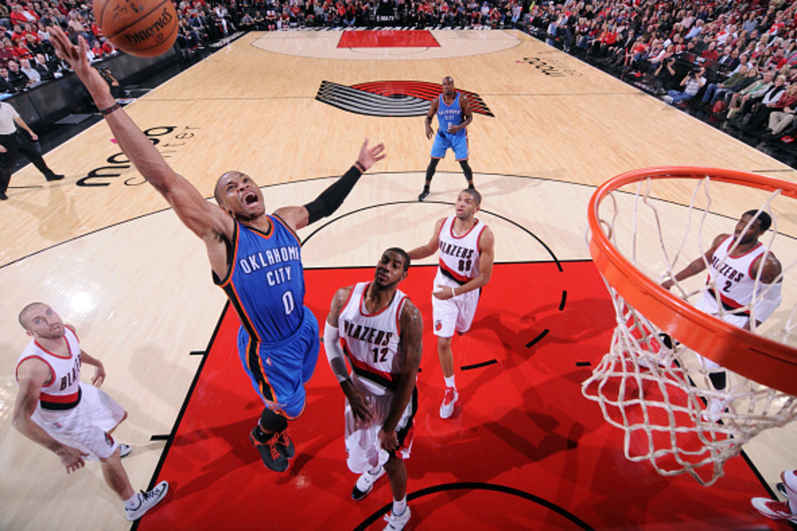PORTLAND, OR - OCTOBER 29: Russell Westbrook #0 of the Oklahoma City Thunder grabs a rebound against the Portland Trail Blazers on October 29, 2014 in Portland, OR. NOTE TO USER: User expressly acknowledges and agrees that, by downloading and/or using thi