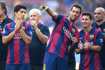 BARCELONA, SPAIN - AUGUST 18:  (L-R) Luis Suarez, Sergio Busquets and Lionel Messi of FC Barcelona look on during the official presentation of the FC Barcelona prior to the Joan Gamper Trophy match between FC Barcelona and Club Leon at Camp Nou on August 