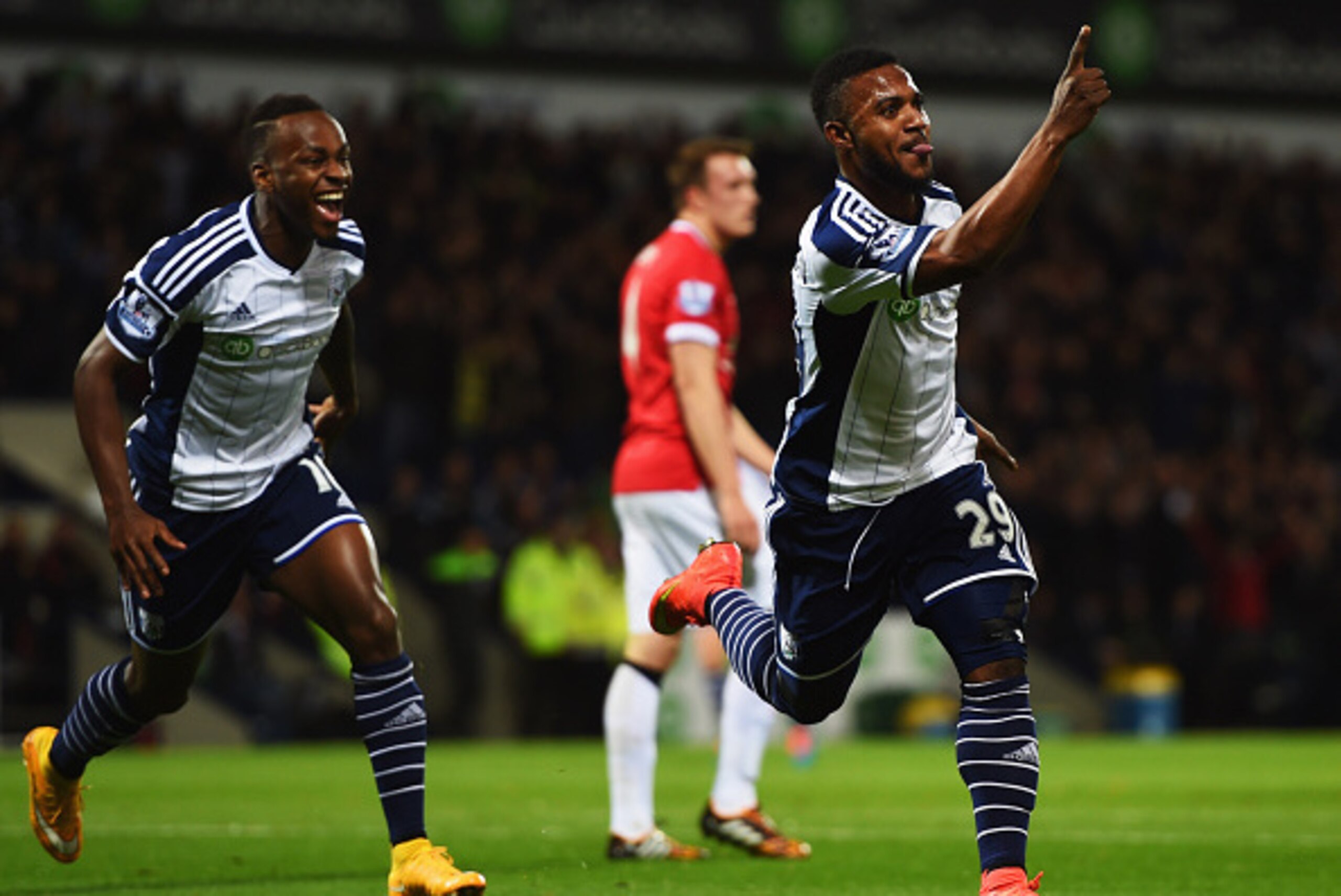 WEST BROMWICH, ENGLAND - OCTOBER 20:  Stephane Sessegnon of West Bromwich Albion (29) celebrates scoring their first goal with team mate Saido Berahino (L) during the Barclays Premier League match between West Bromwich Albion and Manchester United at The 