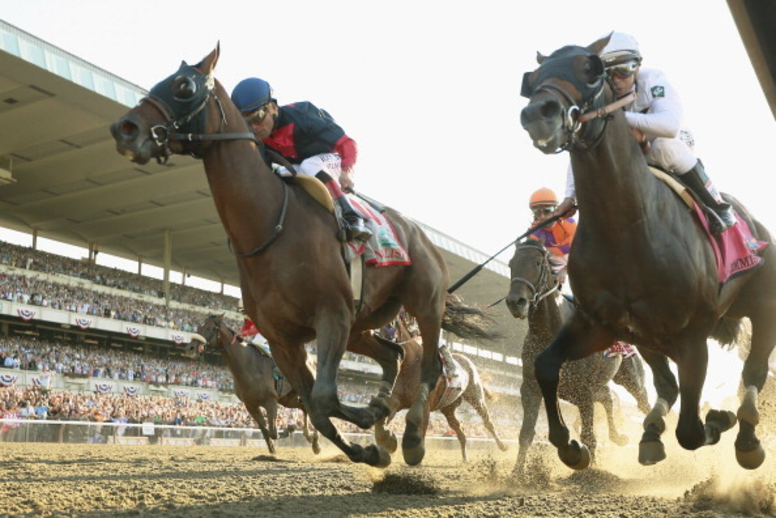 ELMONT, NY - JUNE 07:  Tonalist #11 (L), ridden by Joel Rosario, races to the finish line enroute to winning the 146th running of the Belmont Stakes at Belmont Park on June 7, 2014 in Elmont, New York.  (Photo by Rob Carr/Getty Images)