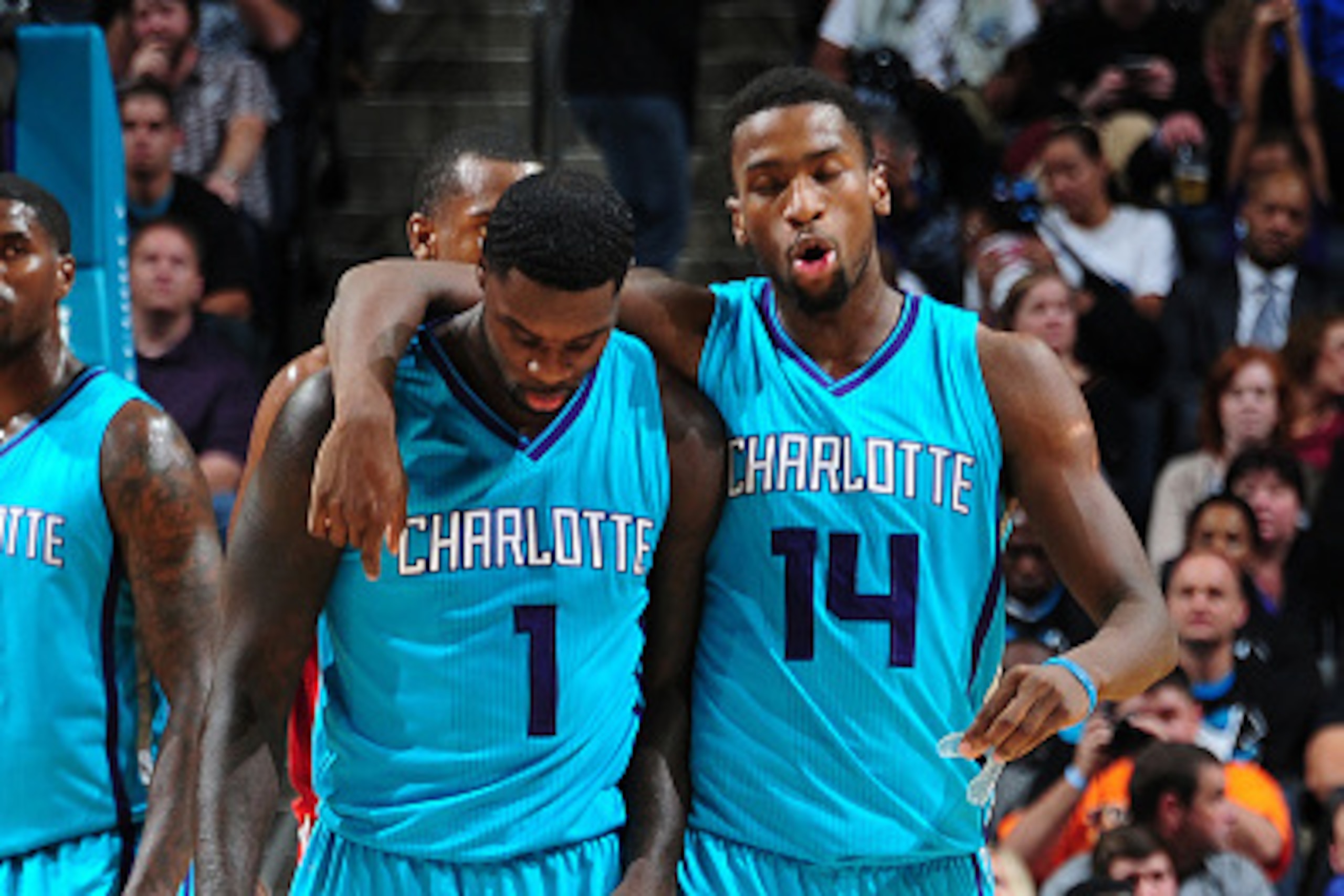 CHARLOTTE, NC - OCTOBER 29: Lance Stephenson #1 and Michael Kidd-Gilchrist #14 of the Charlotte Hornets celebrate  during the game against the Milwaukee Bucks on October 29, 2014 at Time Warner Cable Arena in Charlotte, North Carolina.  NOTE TO USER: User