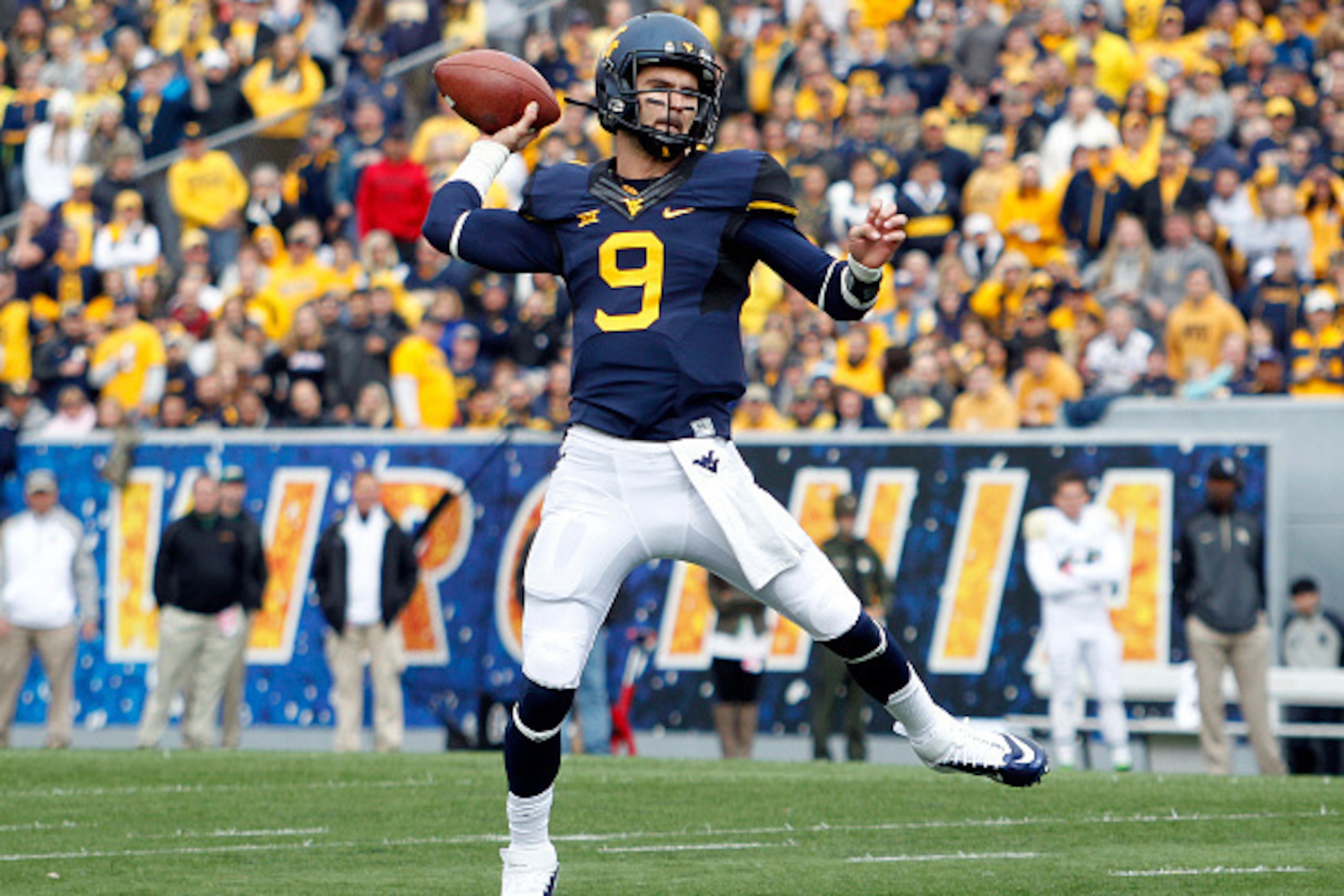MORGANTOWN, WV - OCTOBER 18:  Clint Trickett #9 of the West Virginia Mountaineers drops back to pass against the Baylor Bears during the game on October 18, 2014 at Mountaineer Field in Morgantown, West Virginia.  (Photo by Justin K. Aller/Getty Images)