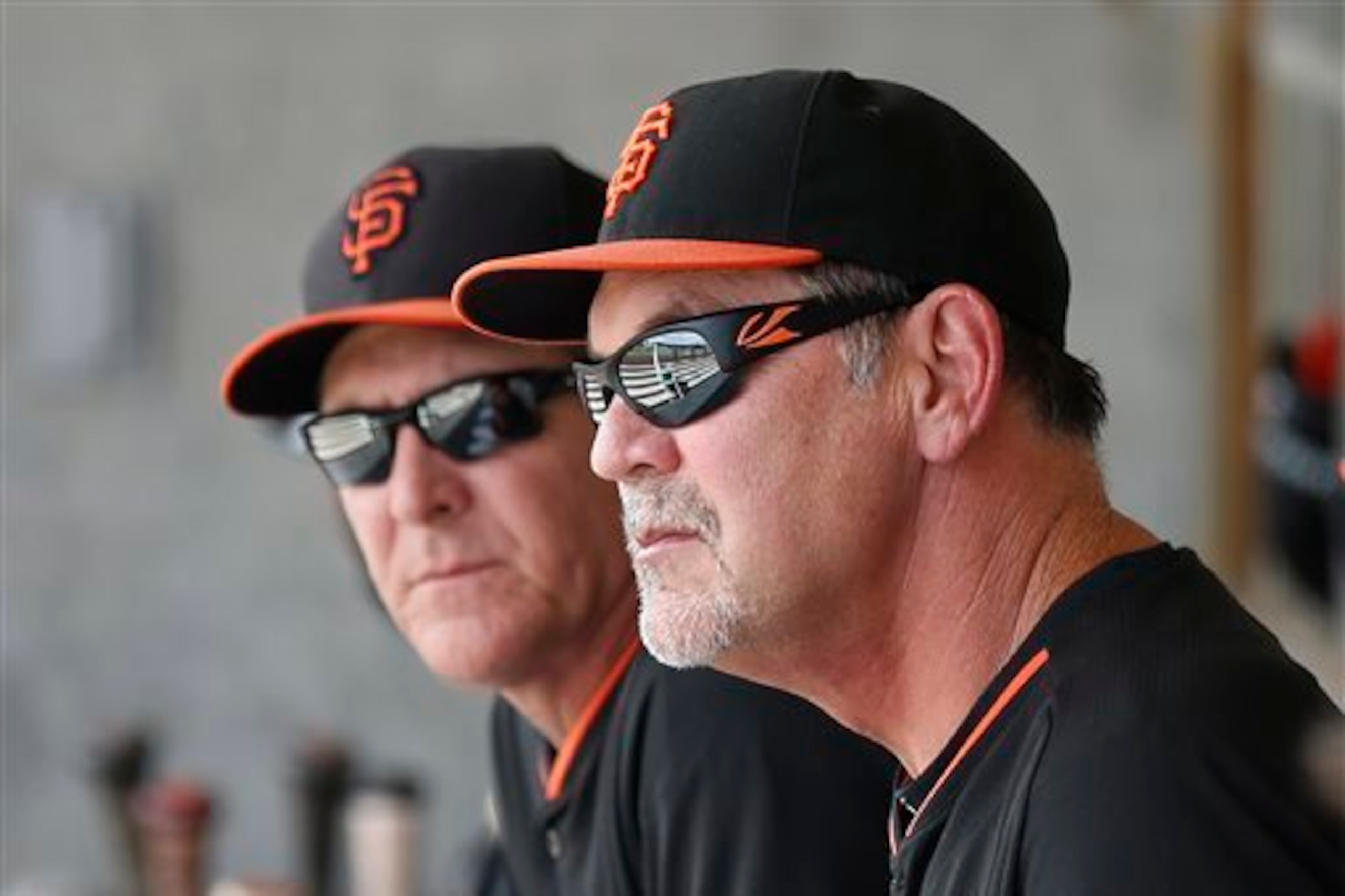 Giants pitching coach Dave Righetti (left) and manager Bruce Bochy will stay on top of Bumgarner's workload in 2015.