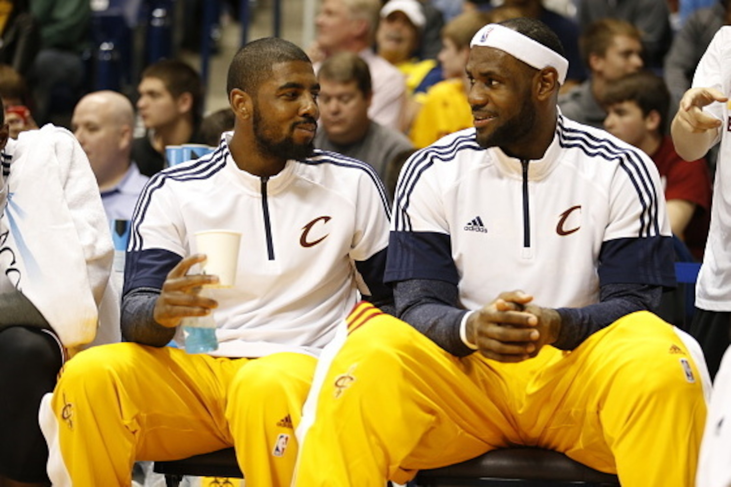 CINNCINNATI, OH - OCTOBER 15:  Kyrie Irving #2 of the Cleveland Cavaliers and teammate LeBron James #23 of sit on the bench during the game against the Indiana Pacers at the Cintas Center at Xavier University on October 15, 2014 in Cincinnati, Ohio. NOTE 