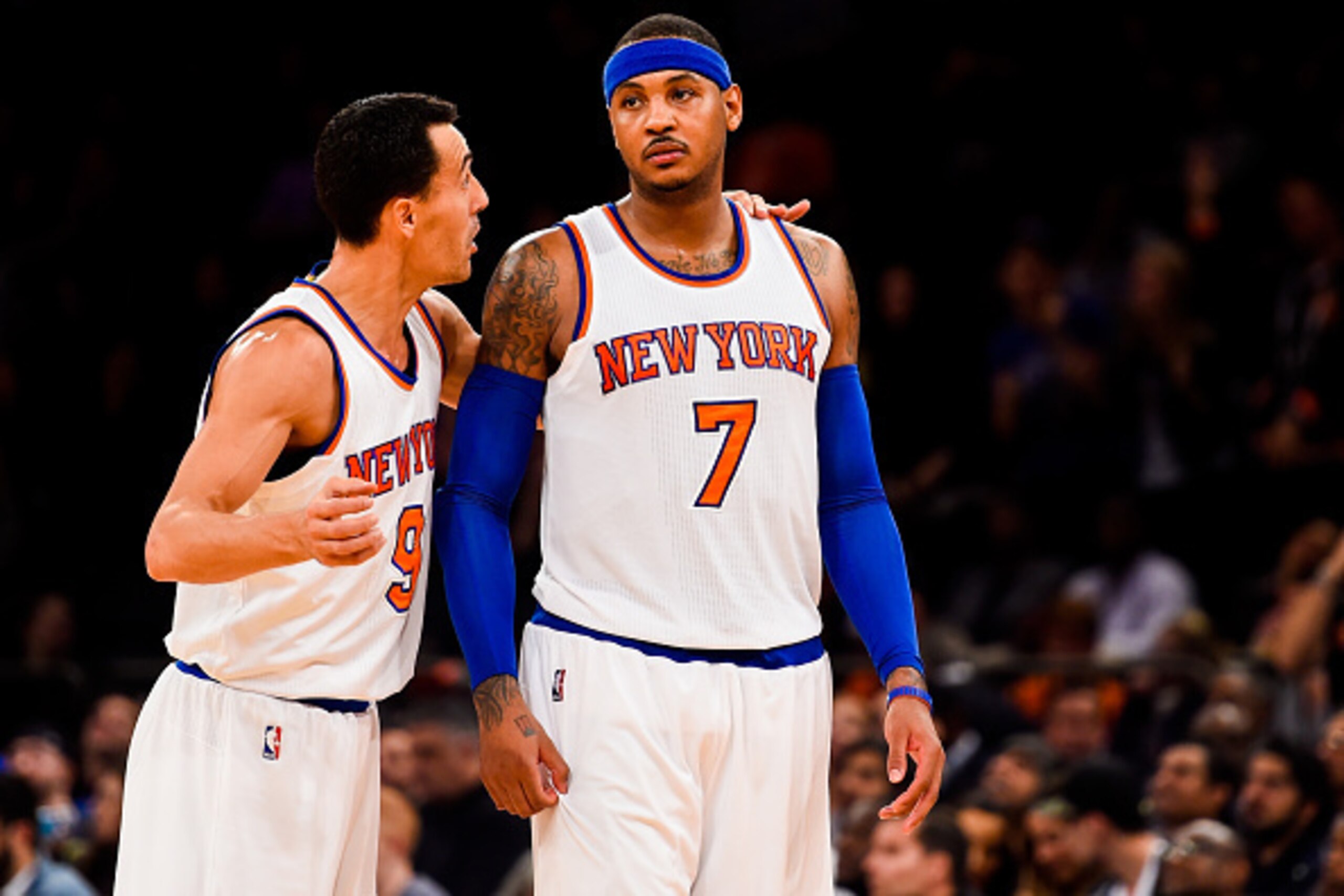NEW YORK, NY - OCTOBER 22: Pablo Prigioni #9 of the New York Knicks speaks to Carmelo Anthony #7 in a preseason game against the Washington Wizards at Madison Square Garden on October 22, 2014 in New York City. NOTE TO USER: User expressly acknowledges an
