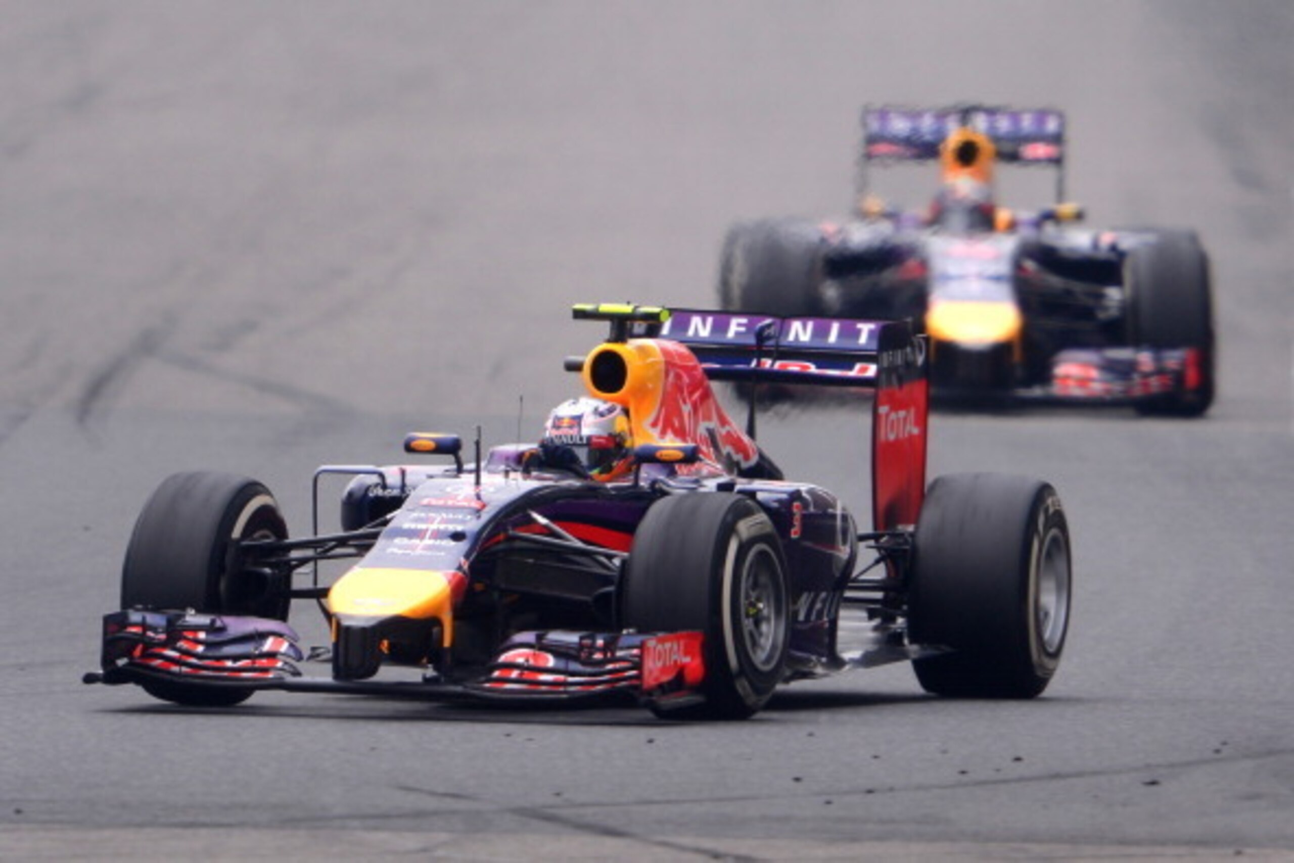 SHANGHAI, CHINA - APRIL 20:  Daniel Ricciardo of Australia and Infiniti Red Bull Racing  leads teammate Sebastian Vettel of Germany and Infiniti Red Bull Racing during the Chinese Formula One Grand Prix at the Shanghai International Circuit on April 20, 2