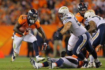 DENVER, CO - OCTOBER 23:  Running back Ronnie Hillman #23 of the Denver Broncos rushes against the San Diego Chargers during a game at Sports Authority Field at Mile High on October 23, 2014 in Denver, Colorado.  (Photo by Justin Edmonds/Getty Images)