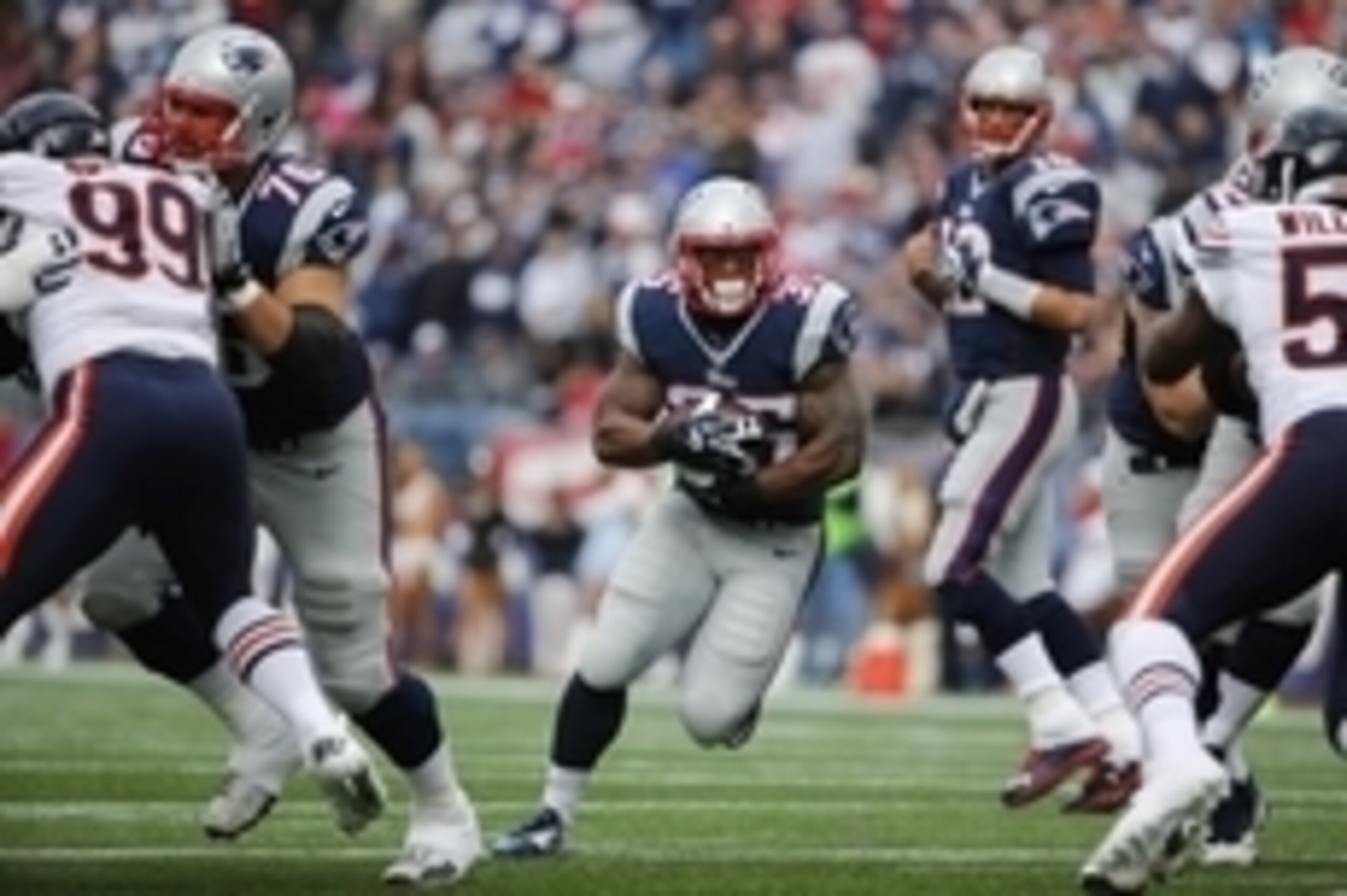 Oct 26, 2014; Foxborough, MA, USA; New England Patriots running back Jonas Gray (35) carries the ball between Chicago Bears defensive end Lamarr Houston (99) and middle linebacker D.J. Williams (58) during the first half at Gillette Stadium. Mandatory Cre