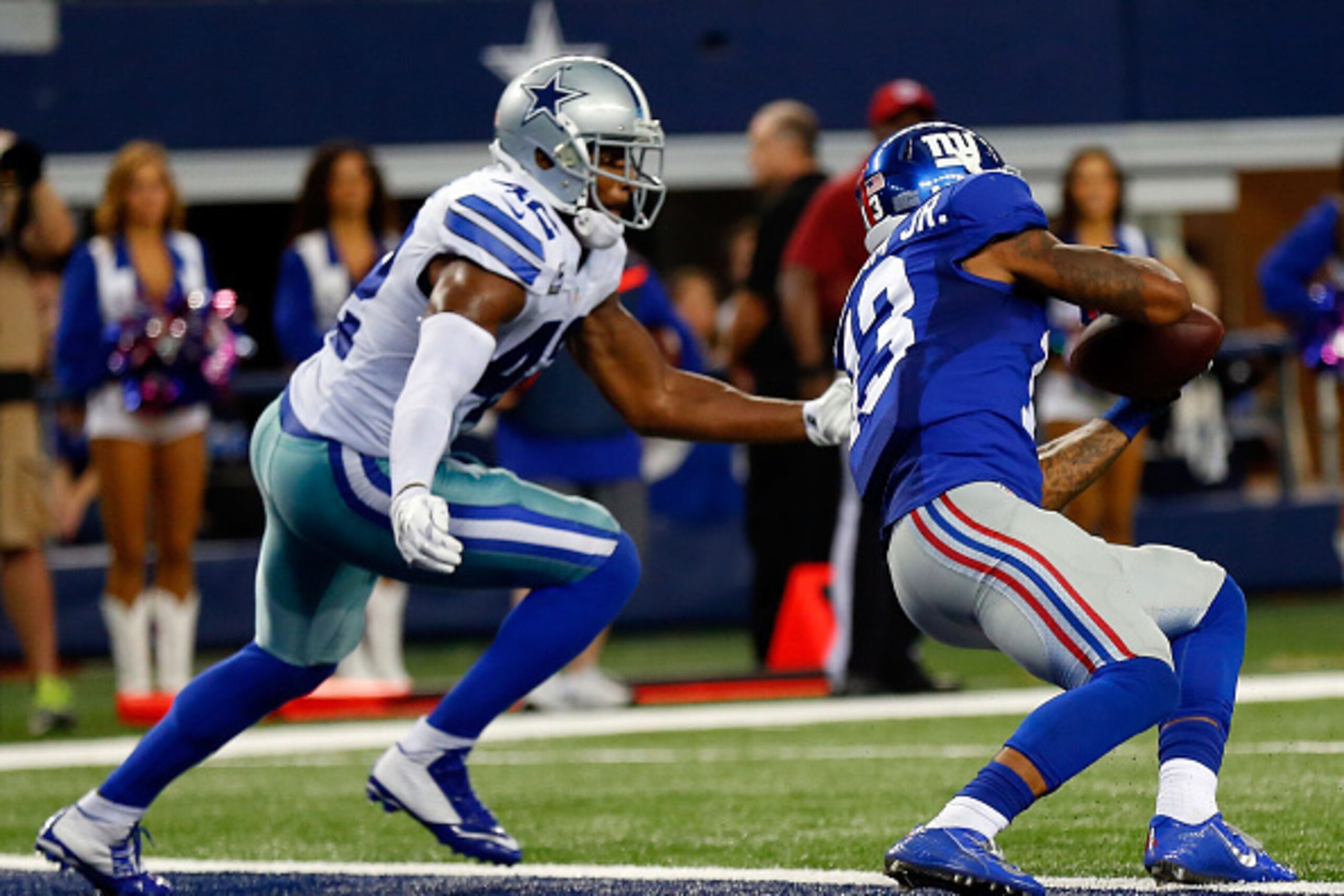ARLINGTON, TX - OCTOBER 19:  Odell Beckham Jr. #13 of the New York Giants makes the catch for a touchdown as Barry Church #42 of the Dallas Cowboys defends in the second half at AT&T Stadium on October 19, 2014 in Arlington, Texas.  (Photo by Wesley Hitt/