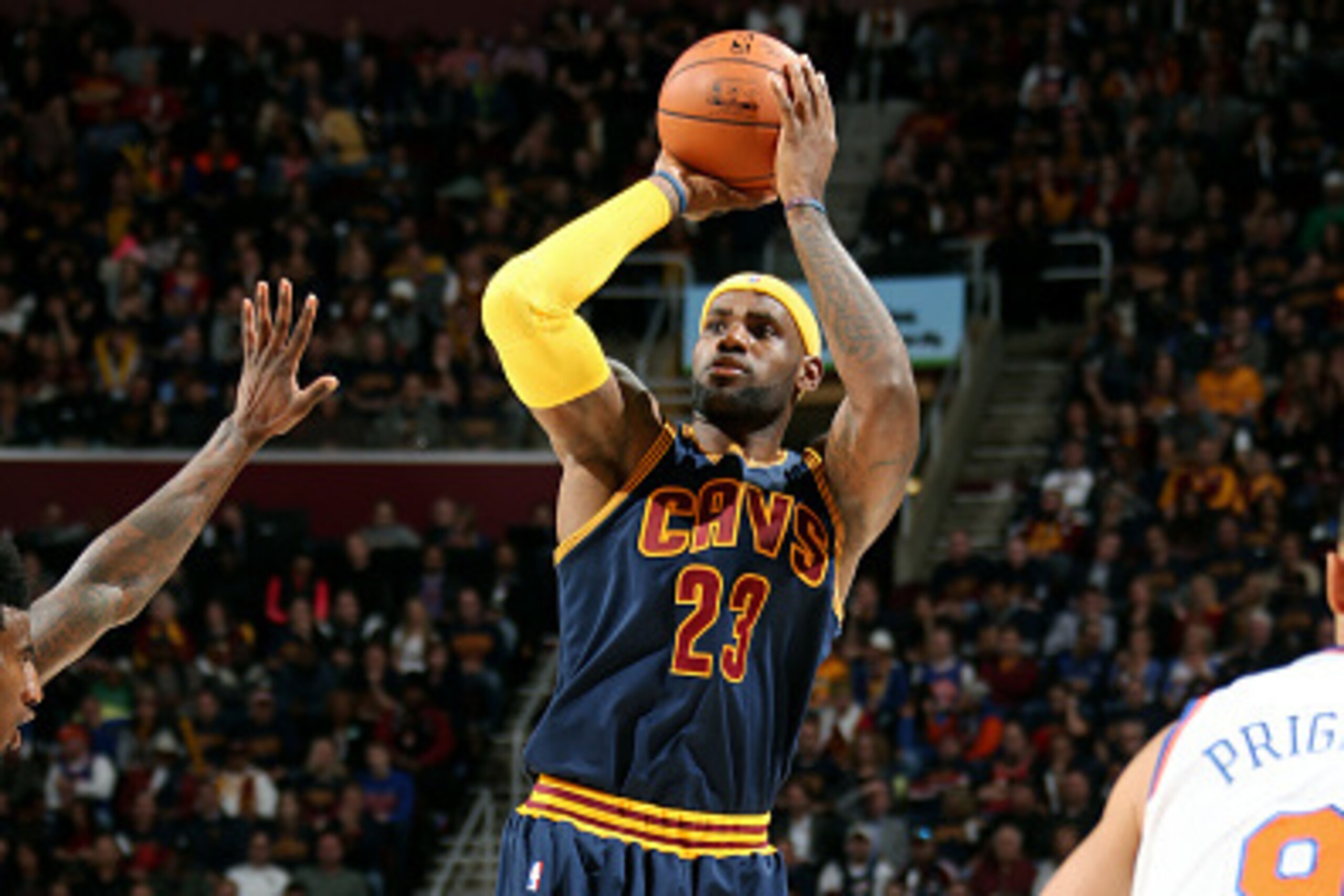 CLEVELAND, OH - OCTOBER 30: LeBron James #23 of the Cleveland Cavaliers shoots against the New York Knicks on October 30, 2014 in Cleveland, Ohio. NOTE TO USER: User expressly acknowledges and agrees that, by downloading and/or using this photograph, user