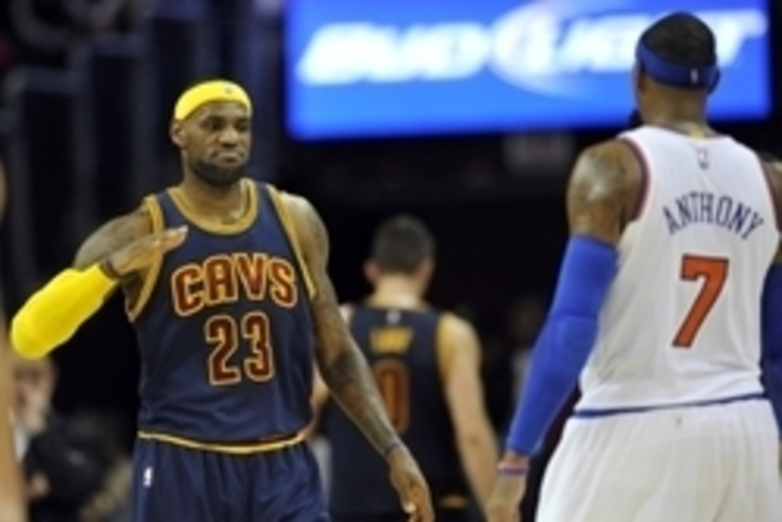 Oct 30, 2014; Cleveland, OH, USA; Cleveland Cavaliers forward LeBron James (23) reacts with New York Knicks forward Carmelo Anthony (7) after the Knicks's 95-90 win over the Cavaliers at Quicken Loans Arena. Mandatory Credit: David Richard-USA TODAY Sport