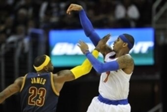Oct 30, 2014; Cleveland, OH, USA; New York Knicks forward Carmelo Anthony (7) shoots over Cleveland Cavaliers forward LeBron James (23) in the third quarter at Quicken Loans Arena. Mandatory Credit: David Richard-USA TODAY Sports