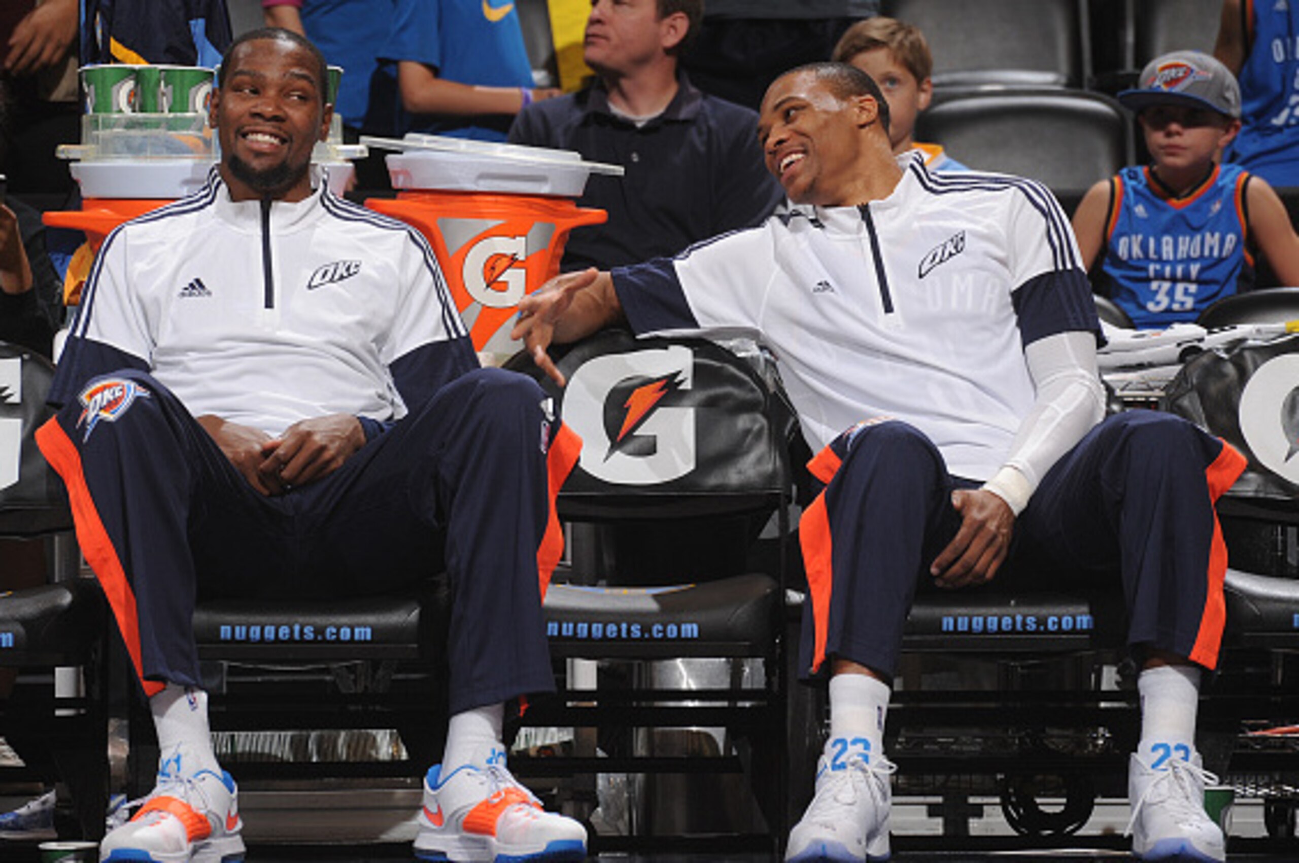 DENVER, CO - OCTOBER 8: Kevin Durant #35 and Russell Westbrook #0 of the Oklahoma City Thunder smile during the game against the Denver Nuggets on October 8, 2014 at the Pepsi Center in Denver, Colorado. NOTE TO USER: User expressly acknowledges and agree