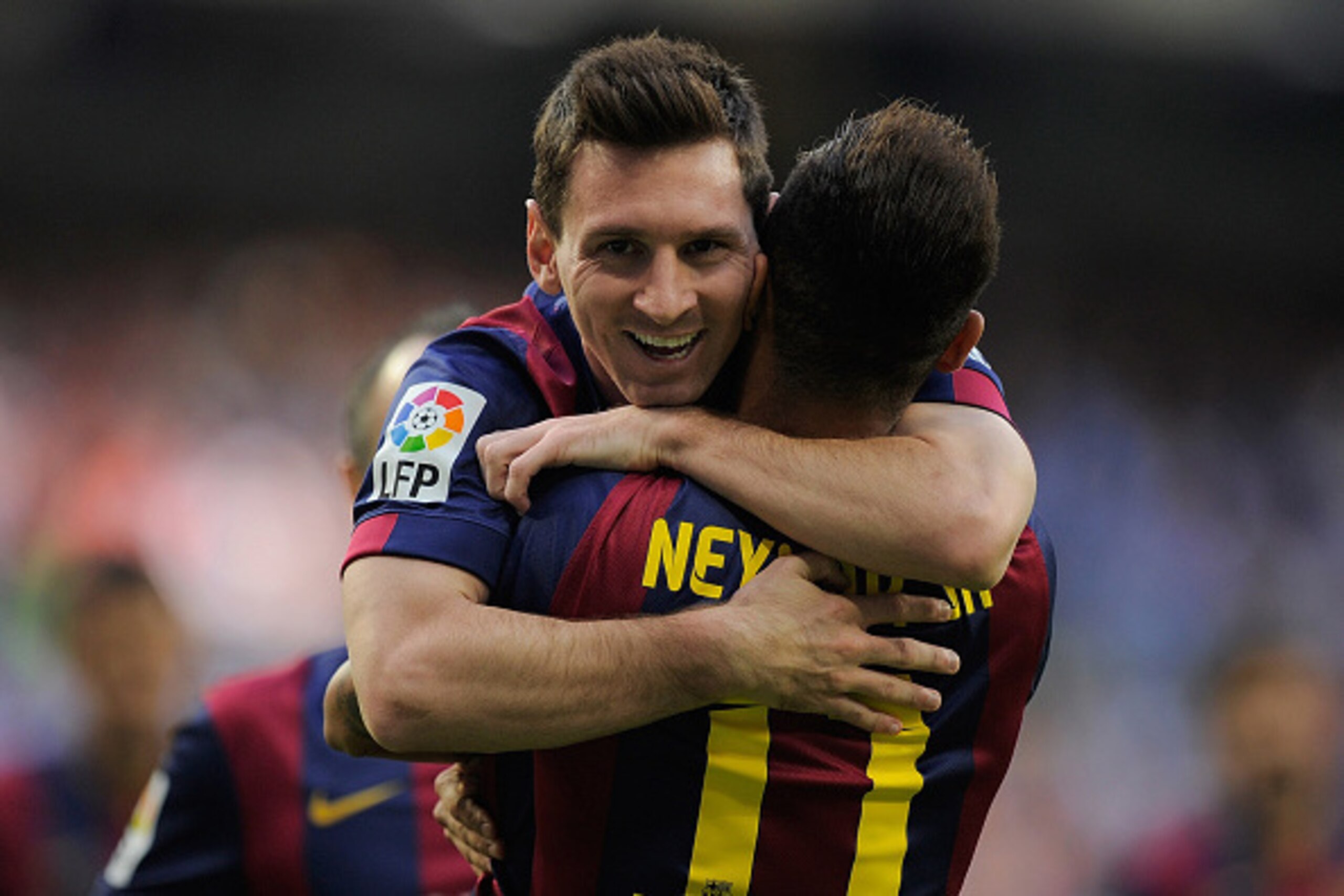 MADRID, SPAIN - OCTOBER 25:   Lionel Messi of FC Barcelona celebrates with Neymar after Neymar scored his team's opening goal during the La Liga match between Real Madrid CF and FC Barcelona at Estadio Santiago Bernabeu on October 25, 2014 in Madrid, Spai