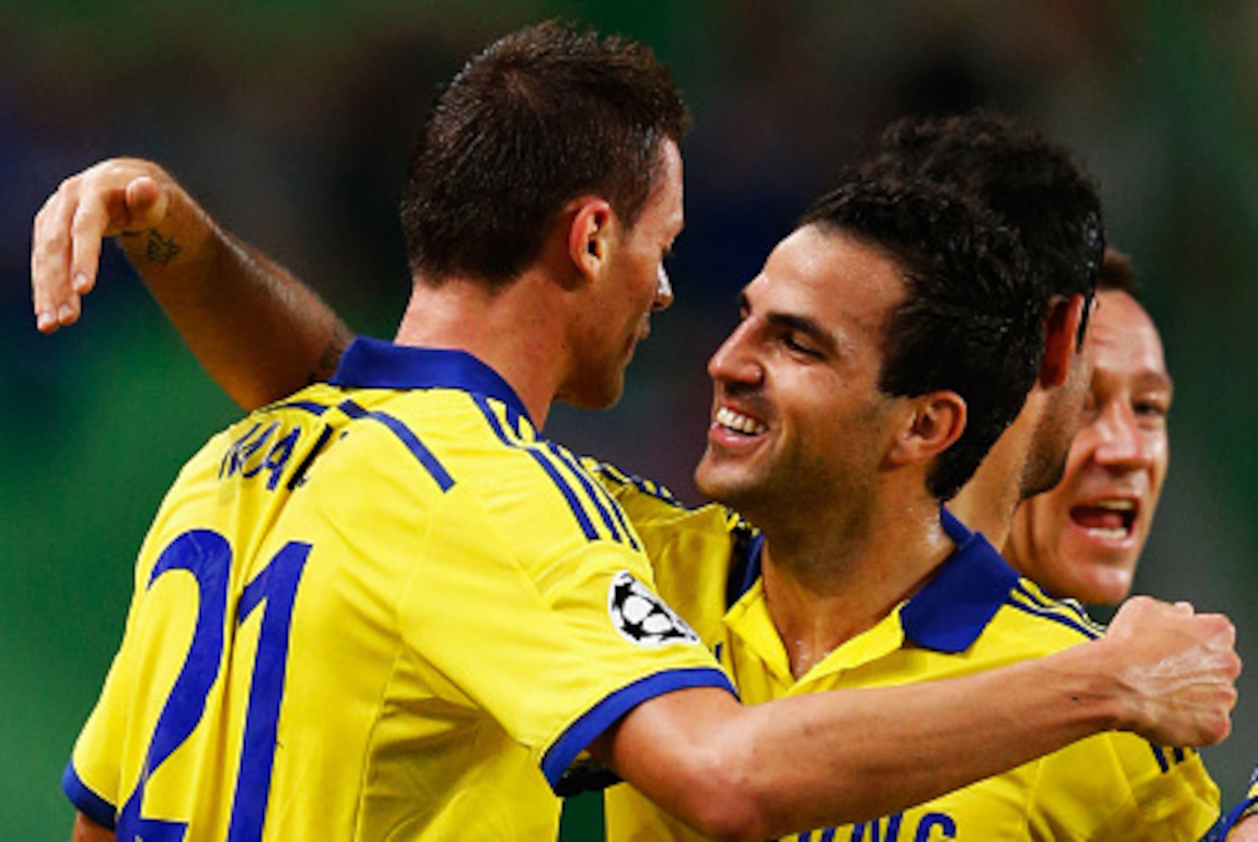 LISBON, PORTUGAL - SEPTEMBER 30:  Nemanja Matic of Chelsea (21) celebrates with team mate Cesc Fabregas as he scores their first goal  during the UEFA Champions League Group G match between Sporting Clube de Portugal and Chelsea FC at Estadio Jose Alvalad
