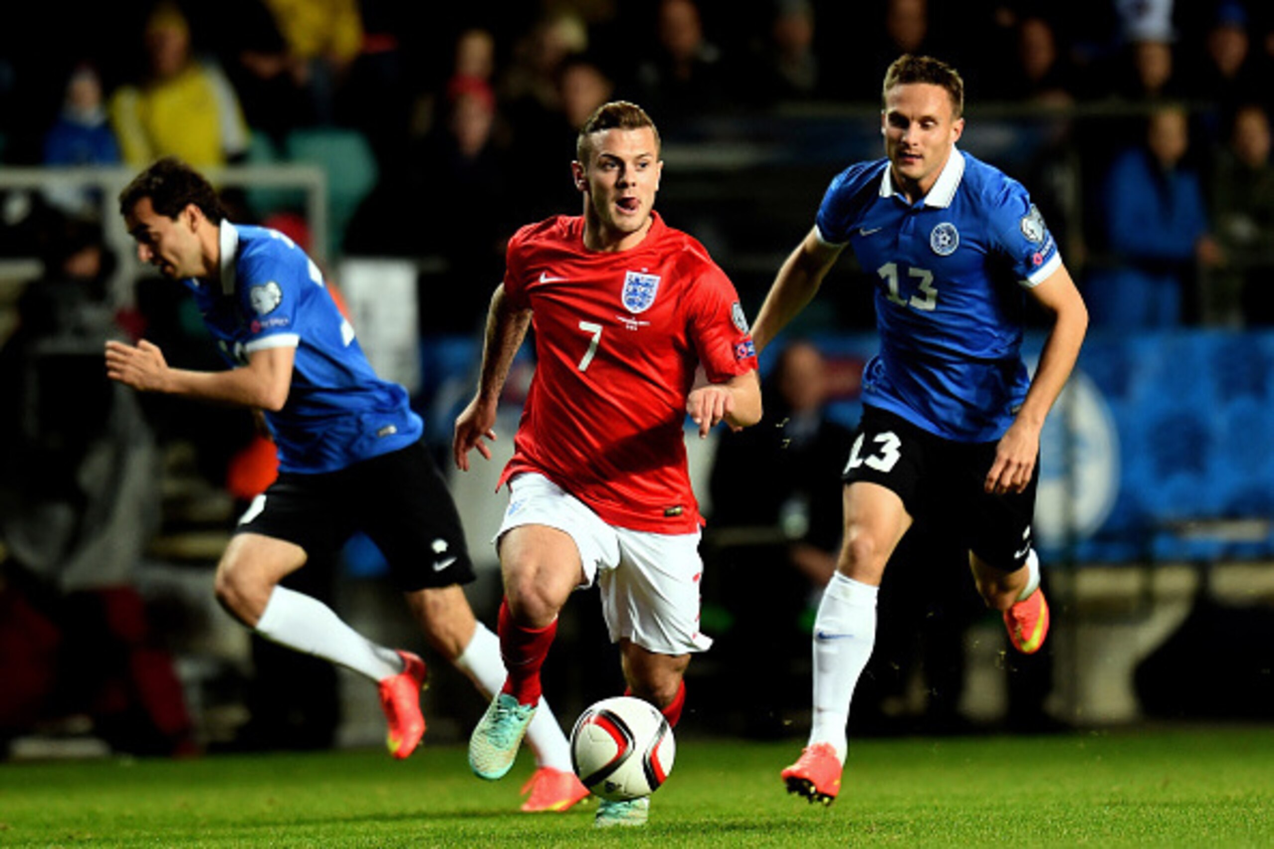 TALLINN, ESTONIA - OCTOBER 12:  Jack Wilshere of England is pursued by Martin Vunk of Estonia during the EURO 2016 Qualifier match between Estonia and England at A. Le Coq Arena on October 12, 2014 in Tallinn, Estonia.  (Photo by Shaun Botterill/Getty Ima