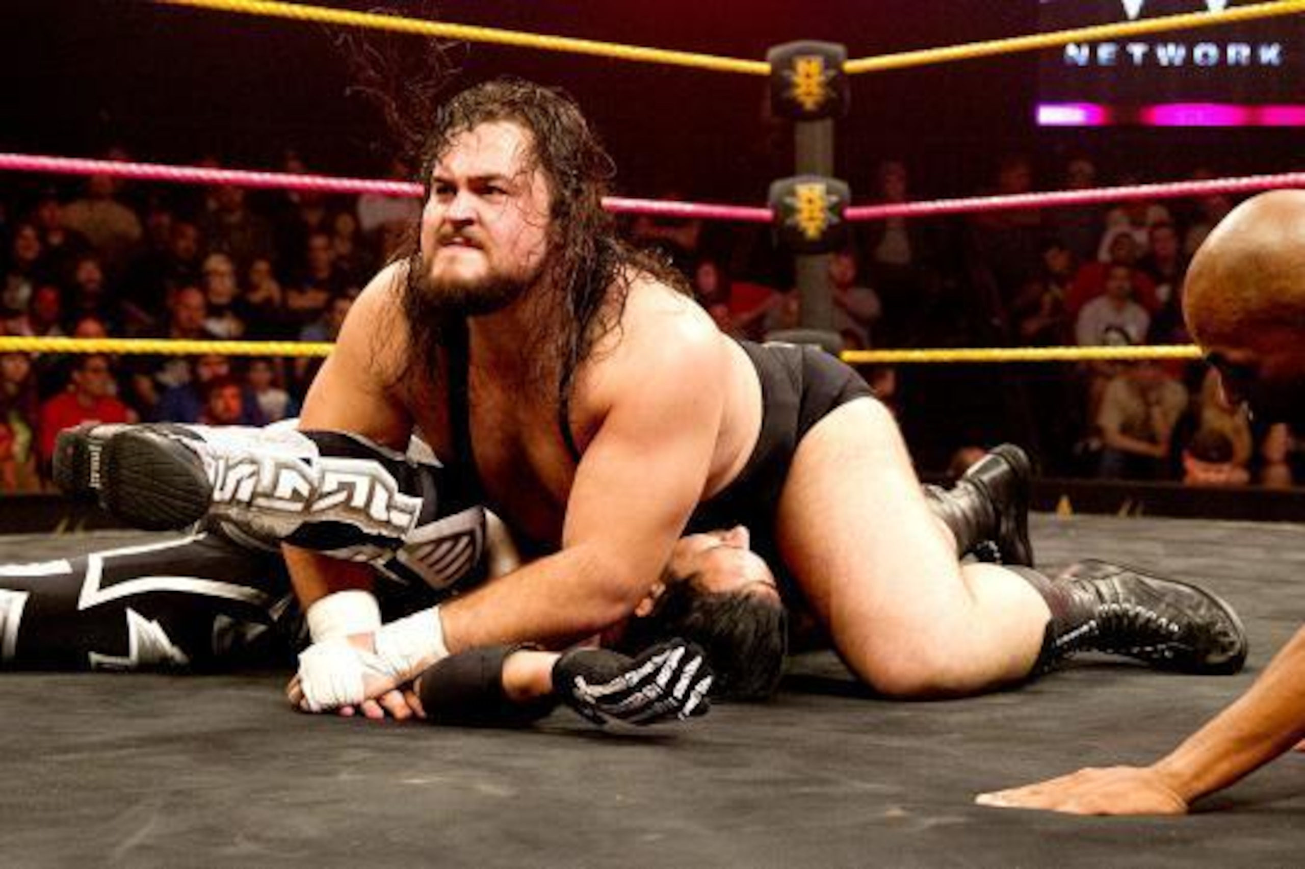 Bull Dempsey pins Justin Gabriel.