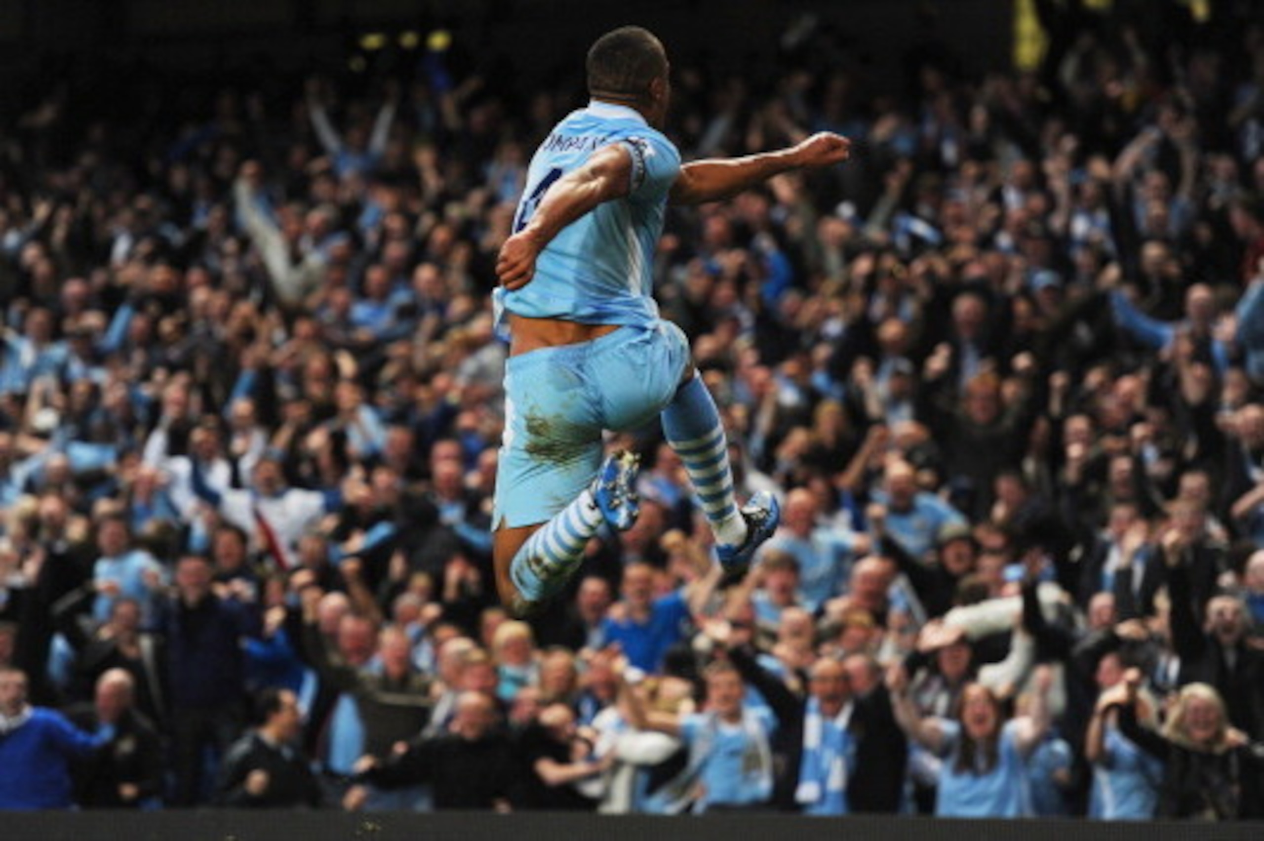MANCHESTER, ENGLAND - APRIL 30: Vincent Kompany of Manchester City celebrates scoring to make it 1-0 during the Barclays Premier League match between Manchester City and Manchester United at Etihad Stadium on April 30, 2012 in Manchester, England.  (Photo