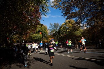 NEW YORK, NY - NOVEMBER 03:  Runners run through Central Park while participating in the ING New York City Marathon on November 3, 2013 in New York City. With the Boston Marathon bombing from earlier this year still fresh in many minds, security is especi