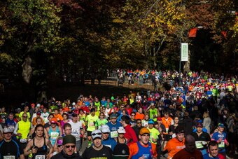 NEW YORK, NY - NOVEMBER 03:  Runners run through Central Park while participating in the ING New York City Marathon on November 3, 2013 in New York City. With the Boston Marathon bombing from earlier this year still fresh in many minds, security is especi