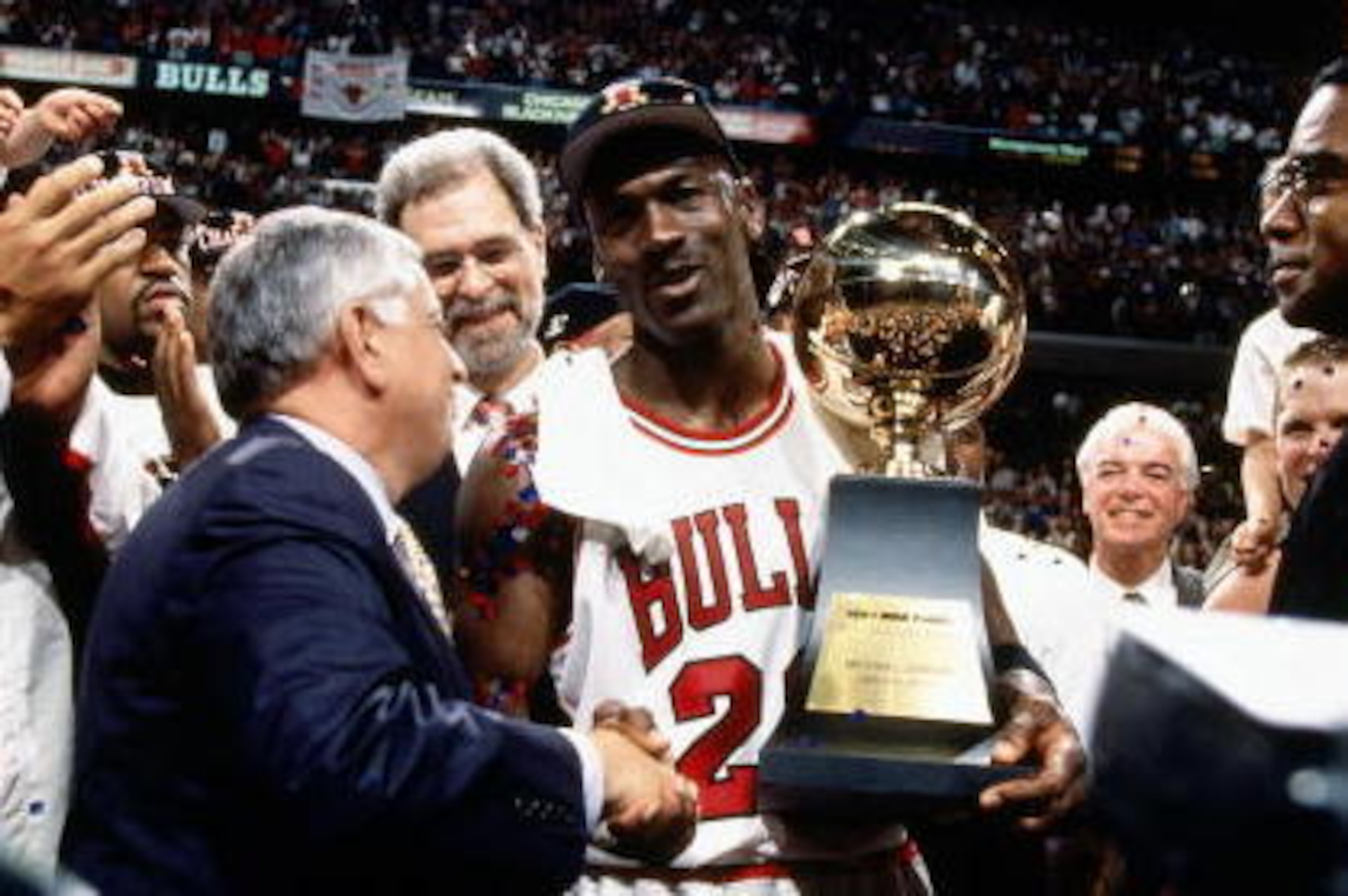 Chicago - JUNE 13: Michael Jordan #23 of the Chicago Bulls celebrates with Bison Dele #18 (formerly known as Brian Williams) after winning the 1997 NBA Finals against the Utah Jazz in Chicago, IL on June 13, 1997.  NOTE TO USER: User expressly acknowledge