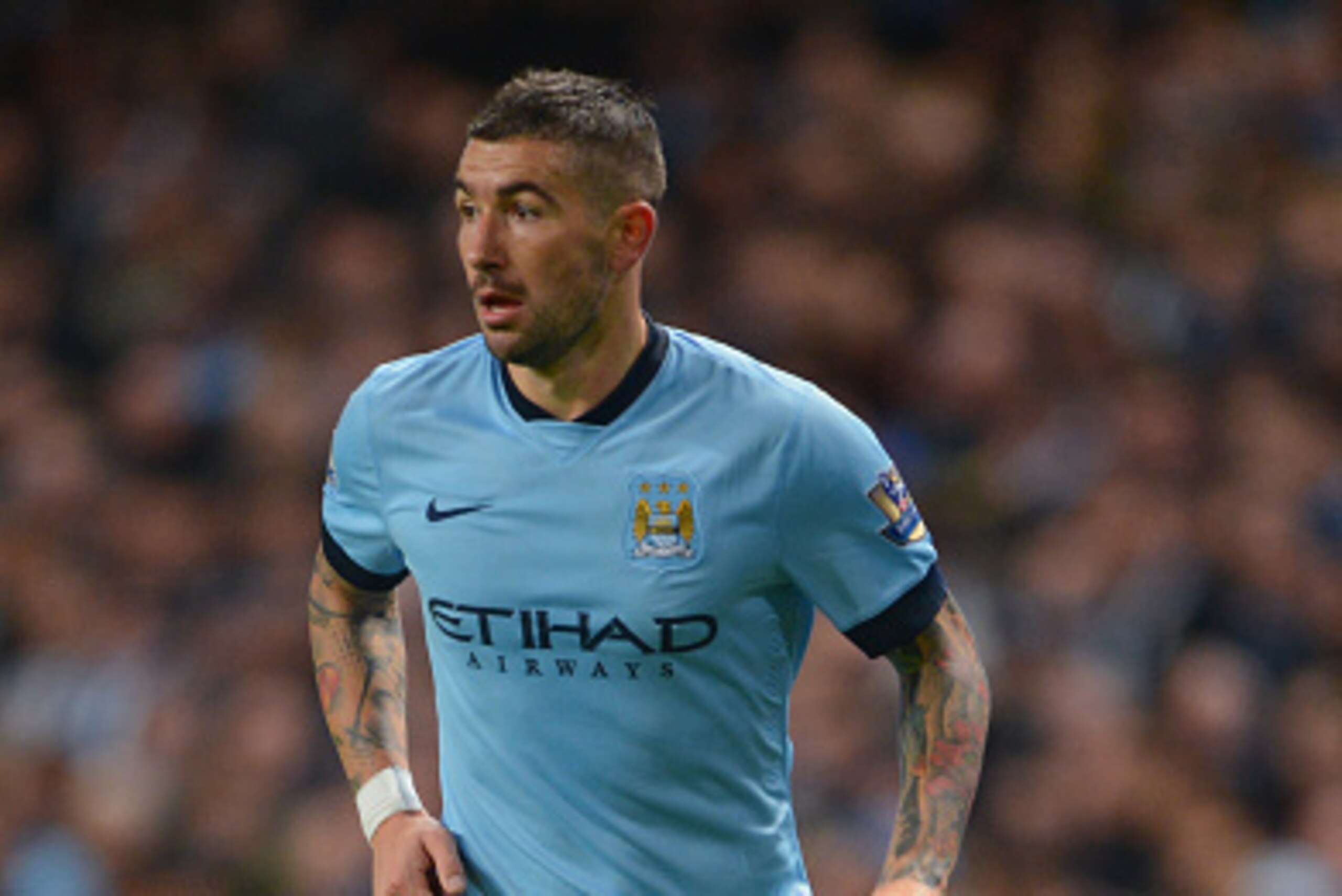 MANCHESTER, ENGLAND - OCTOBER 29: Aleksandar Kolarov of Manchester City in action during the Capital One Cup Fourth Round match between Manchester City and Newcastle United at Etihad Stadium on October 29, 2014 in Manchester, England.  (Photo by Michael R