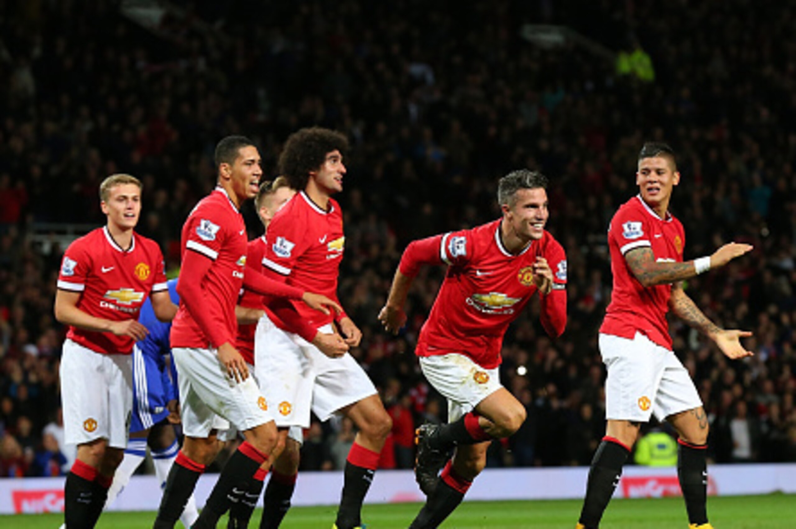 MANCHESTER, ENGLAND - OCTOBER 26:  Robin van Persie of Manchester United celebrates scoring the equalising goal during the Barclays Premier League match between Manchester United and Chelsea at Old Trafford on October 26, 2014 in Manchester, England.  (Ph