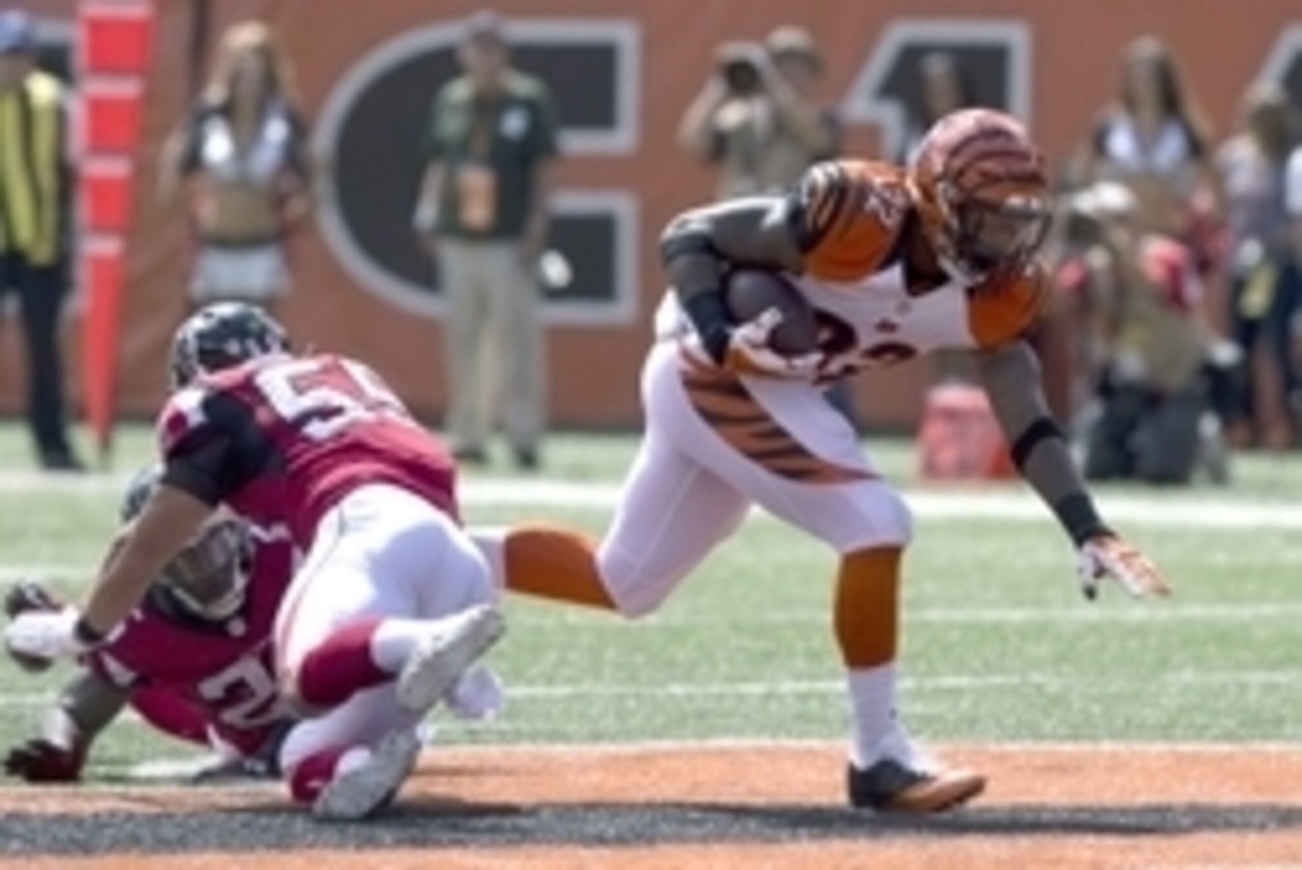 Sep 14, 2014; Cincinnati, OH, USA; Cincinnati Bengals running back Jeremy Hill (32) carries the ball against the Atlanta Falcons at Paul Brown Stadium. The Bengals won 24-10. Mandatory Credit: Aaron Doster-USA TODAY Sports