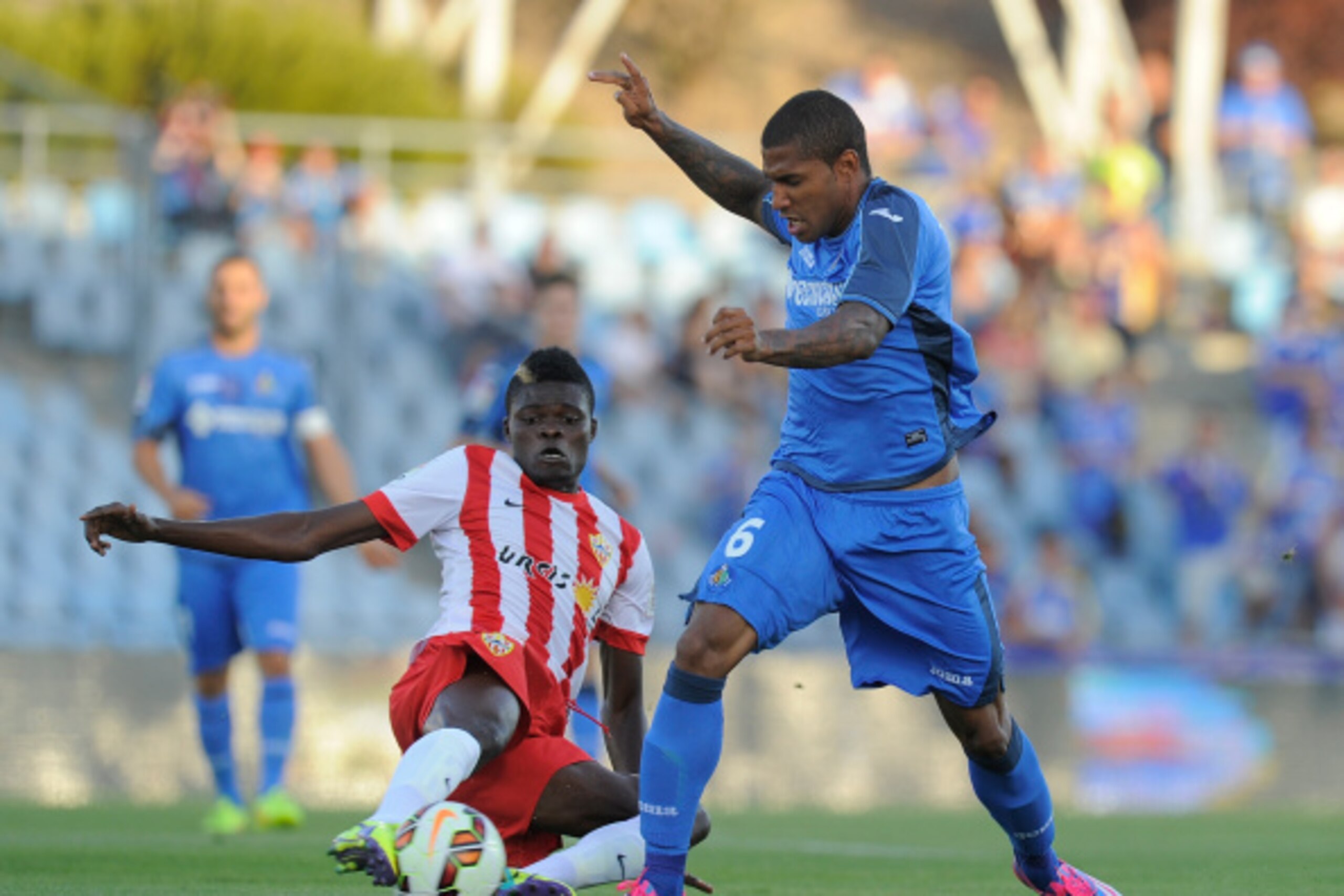 GETAFE, SPAIN - AUGUST 29:  Jorge Sammir (R) of Getafe CF is tackled by Thomas Partey of UD Almeria during the La Liga match between Getafe CF and UD Almeria at Coliseum Alfonso Perez on August 29, 2014 in Getafe, Spain.  (Photo by Denis Doyle/Getty Image