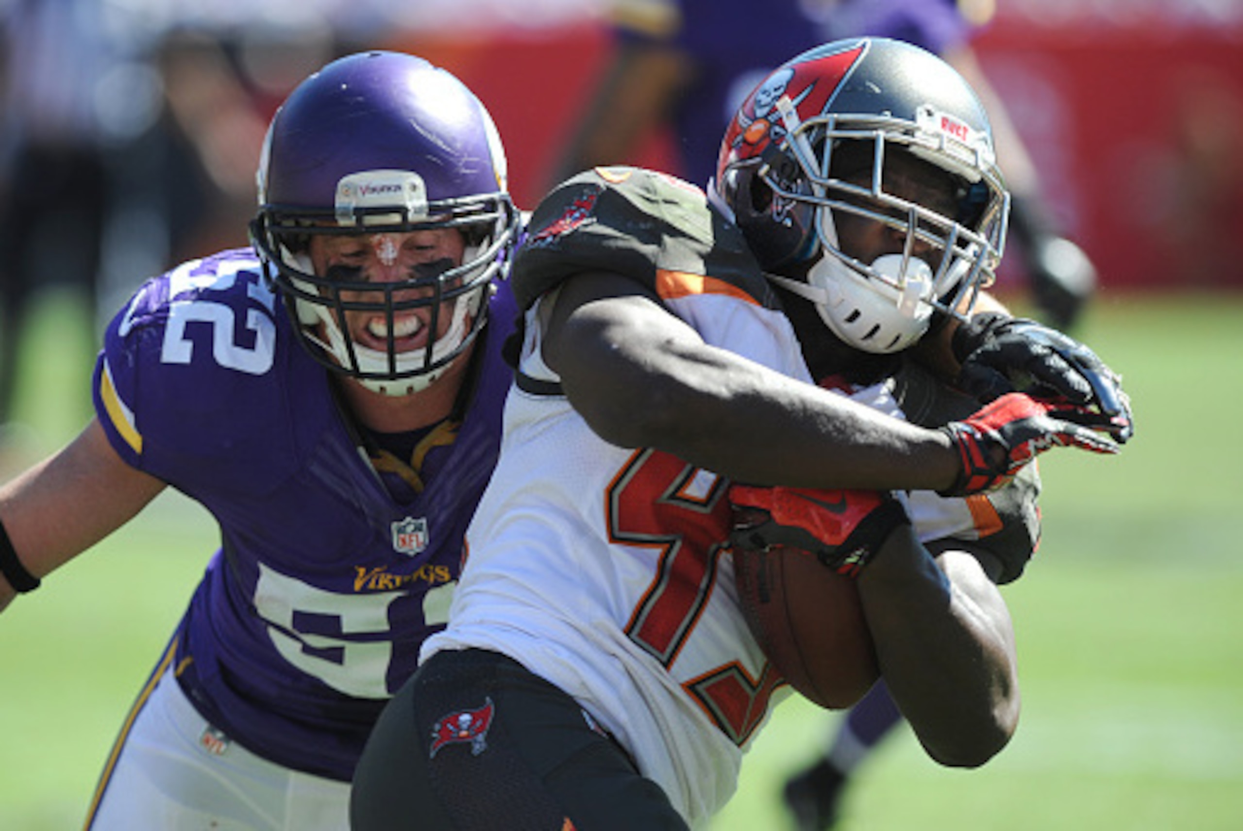 TAMPA, FL - OCTOBER 26: Running back Bobby Rainey #43 of the Tampa Bay Buccaneers is tackled by outside linebacker Chad Greenway #52 of the Minnesota Vikings at Raymond James Stadium on October 26, 2014 in Tampa, Florida. (Photo by Cliff McBride/Getty Ima