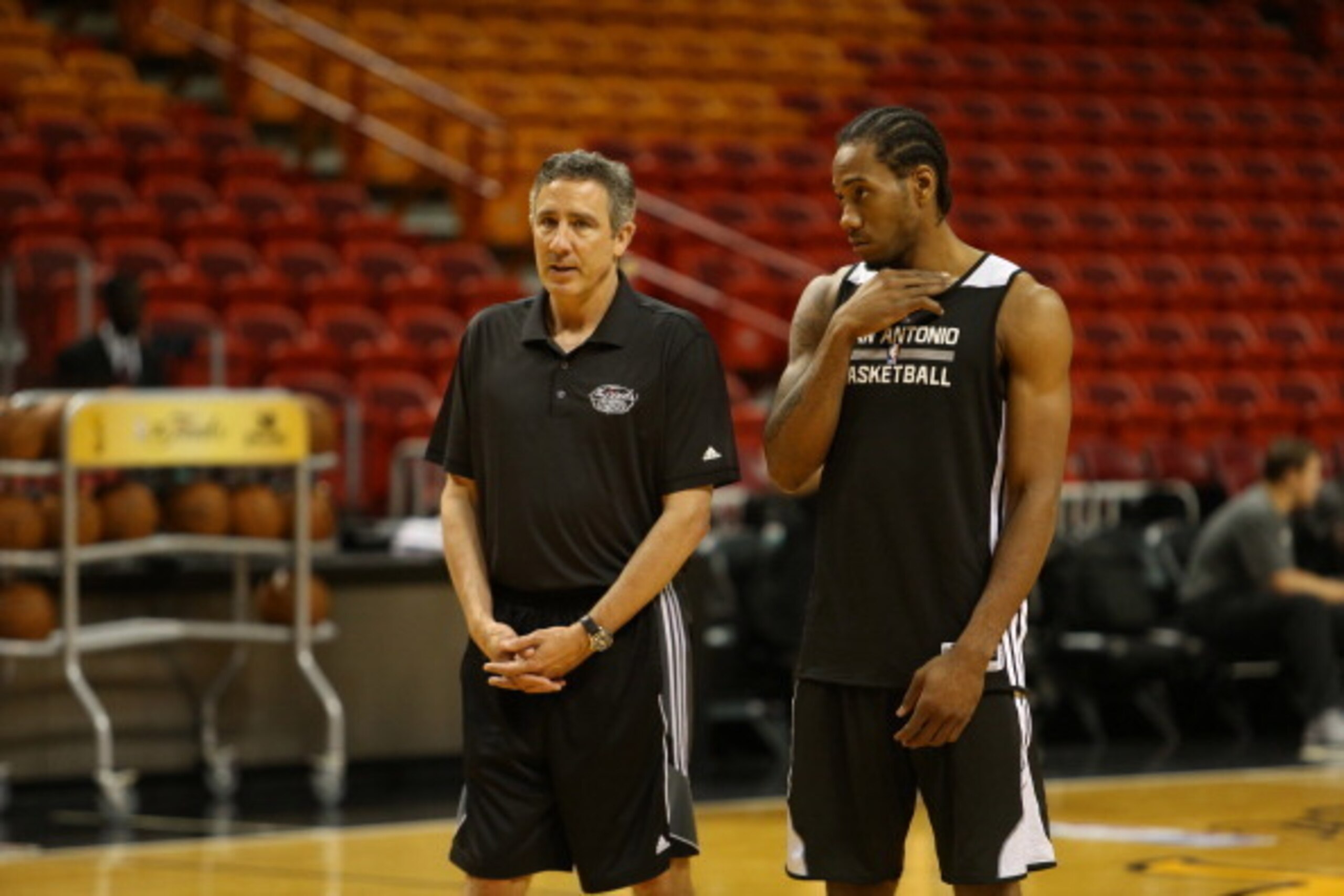 MIAMI, FL JUNE 1:  Chip Engelland speaks to Kawhi Leonard of the San Antonio Spurs during NBA Finals Media Availability on June 11, 2014 at American Airlines Arena in Miami, Florida. NOTE TO USER: User expressly acknowledges and agrees that, by downloadin
