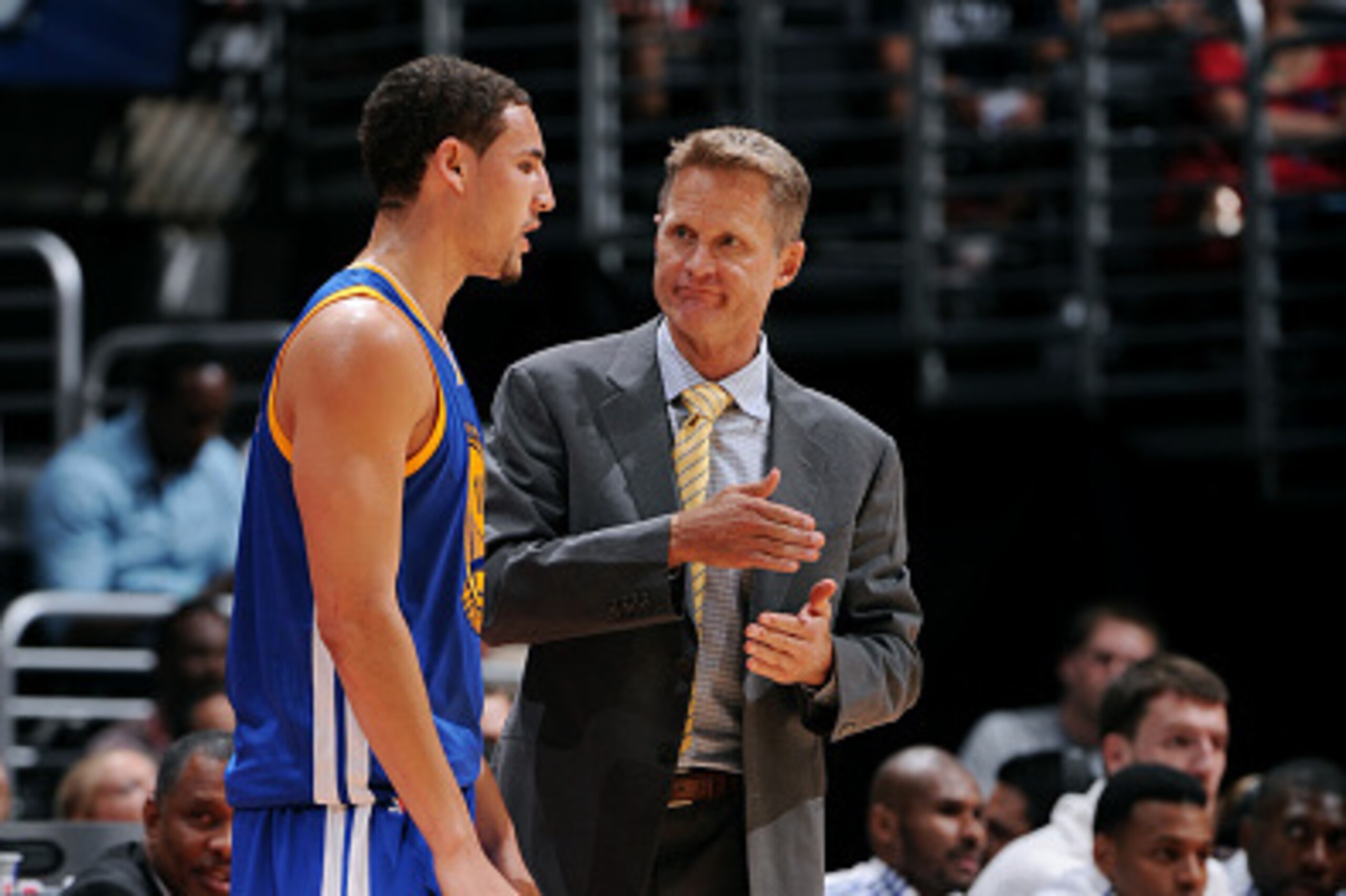LOS ANGELES, CA - OCTOBER 7: Head Coach Steve Kerr and Klay Thompson #11 of the Golden State Warriors speak during a game against the Los Angeles Clippers of the Golden State Warriors speaks to  on October 7, 2014 at the Staples Center in Los Angeles, Cal