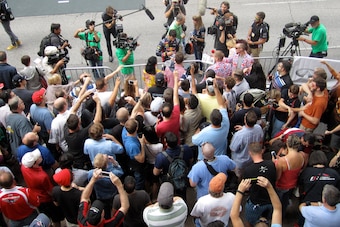 Red Bull's Daniel Ricciardo signs autographs for fans in downtown Austin on Wednesday.