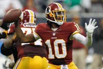 HOUSTON, TX - SEPTEMBER 07:  Robert Griffin III #10 of the Washington Redskins throws down-field in the fourth quarter against the Houston Texans at Reliant Stadium on September 7, 2014 in Houston, Texas.  (Photo by Bob Levey/Getty Images)