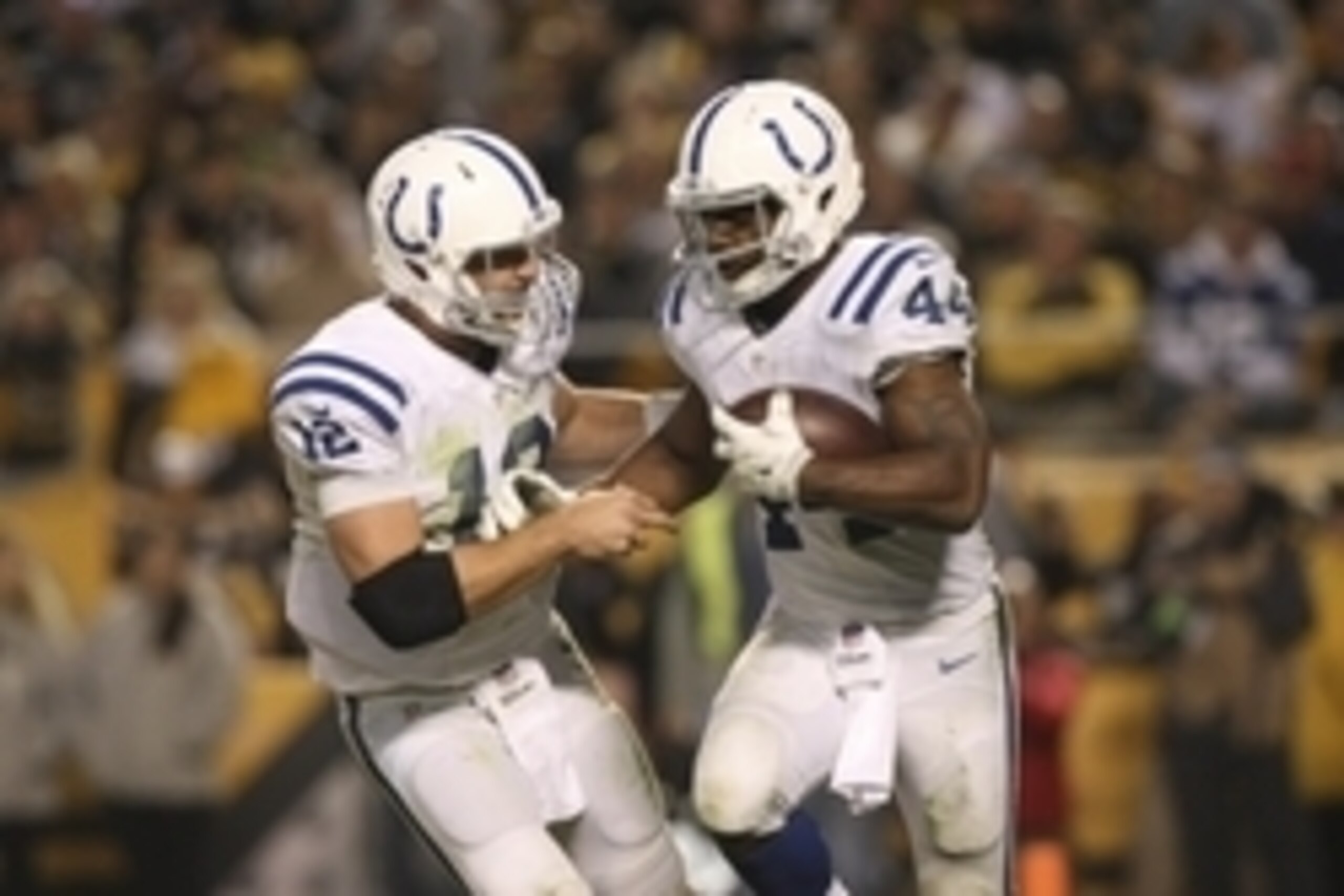 Oct 26, 2014; Pittsburgh, PA, USA; Indianapolis Colts quarterback Andrew Luck (12) congratulates running back Ahmad Bradshaw (44) after Bradshaw scored a touchdown against the Pittsburgh Steelers during the second half of their game at Heinz Field. The St