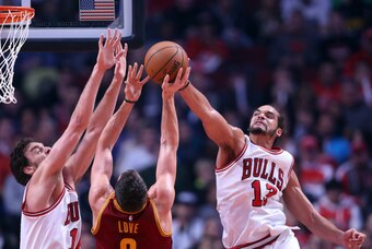 Oct 31, 2014; Chicago, IL, USA; Chicago Bulls center Joakim Noah (13) blocks the shot of Cleveland Cavaliers forward Kevin Love (0) during the first quarter at the United Center. Mandatory Credit: Dennis Wierzbicki-USA TODAY Sports